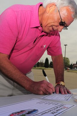 SHAW AIR FORCE BASE, S.C. -- Jesse Robertson, retired Chief Master Sgt., registers his 1966 Chevelle Malibu for the car show here April 3. The 2010 Shaw Car Show was sponsored by the Army and Air Force Exchange Service. (U.S Air Force Photo/Senior Airman David Minor)