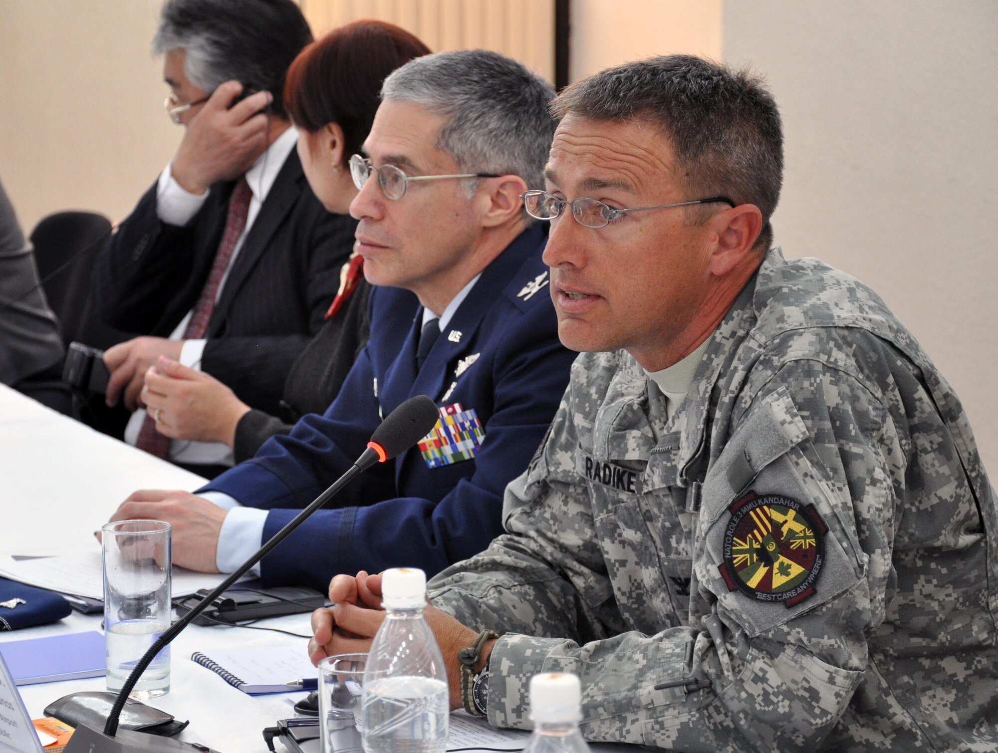 Navy Capt. James Radike, M.D., deputy commander for clinical services in Kandahar, Afghanistan, speaks on "New Methods and Approaches on Diagnosis of Parasitic Diseases" during a conference in Bishkek, Kyrgyzstan, on mass de-worming April 2, 2010. Captain Radike was flown here for the conference to aid the Transit Center at Manas' efforts to reach the entire nation and successfully eradicate parasitic disease. (U.S. Air Force photo/ Staff Sgt. Carolyn Viss)  