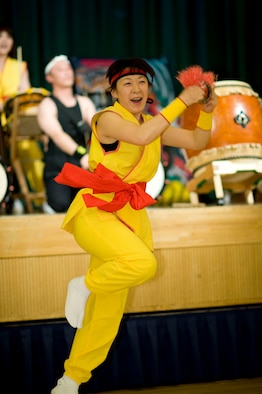 MISAWA AIR BASE, Japan -- Junko Takaya, member of the Towada Suijin Thunder Drummers, dances in front of the stage during the 23rd Annual Japan Day April 3 at the Collocated Club. Japan Day is an annual celebration of Japanese culture, and serves as a precursor to its sister festival, American Day, scheduled to take place June 6. (U.S. Air Force photo/Staff Sgt. Samuel Morse)