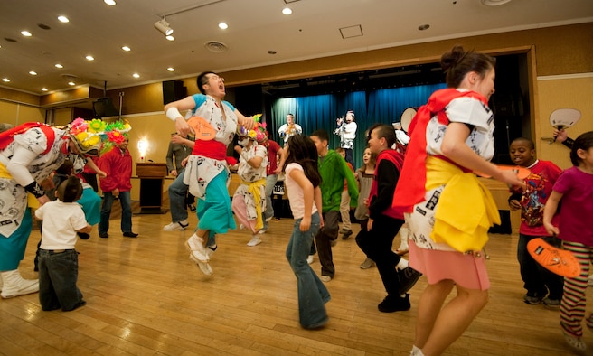 MISAWA AIR BASE, Japan -- Japanese and Americans sing and dance to Nebuta music during the 23rd Annual Japan Day at the Collocated Club April 3. The annual Nebuta Festival is one of the largest festivals in northern Japan. (U.S. Air Force photo/Staff Sgt. Samuel Morse)