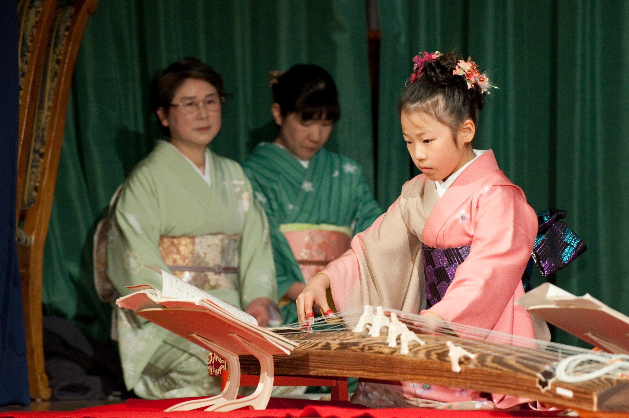MISAWA AIR BASE, Japan -- Nana Miyano, Sokyoku Seigensha koto player, performs during the 23rd Annual Japan Day at the Collocated Club April 3. A koto is a traditional Japanese string instrument played by pinching and plucking the strings. (U.S. Air Force photo/Staff Sgt. Samuel Morse)