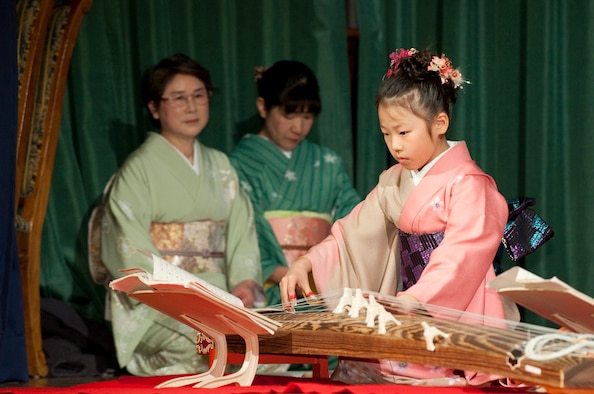 MISAWA AIR BASE, Japan -- Nana Miyano, Sokyoku Seigensha koto player, performs during the 23rd Annual Japan Day at the Collocated Club April 3. A koto is a traditional Japanese string instrument played by pinching and plucking the strings. (U.S. Air Force photo/Staff Sgt. Samuel Morse)