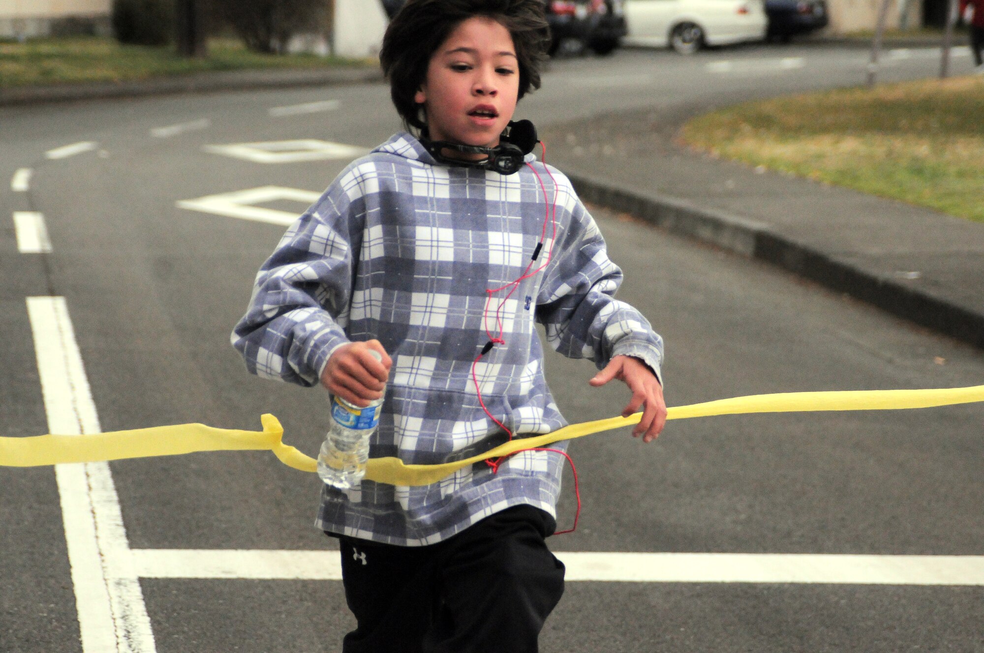 YOKOTA AIR BASE, Japan -- Deven Forbes, 4th grader, finishes first in the Awareness Fun Run, April 3, held to kickoff Awareness Month. April is recognized as the month of Alcohol Awareness, Child Abuse Prevention and Sexual Assault Awareness. (U.S. Air Force photo/Airman 1st Class Katrina R. Menchaca)
