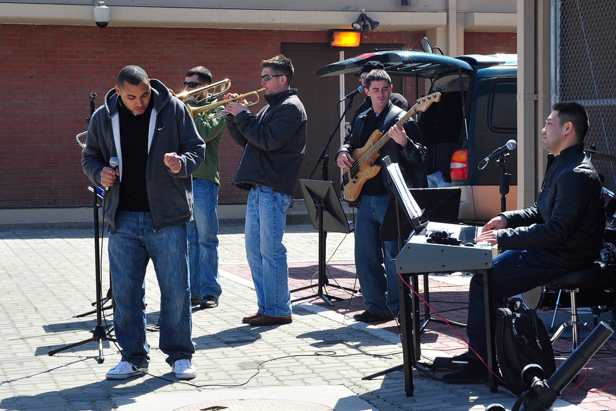 A band made up of Airmen and Soldiers assigned to Osan Air Base, Republic of Korea, give a live performance during an Easter celebration April 3. The day's festivities also included a "Child Abuse Prevention" parade and an Easter egg hunt complete with an appearance by the Easter bunny. (U.S. Air Force photo/Staff Sgt. Eunique Stevens)