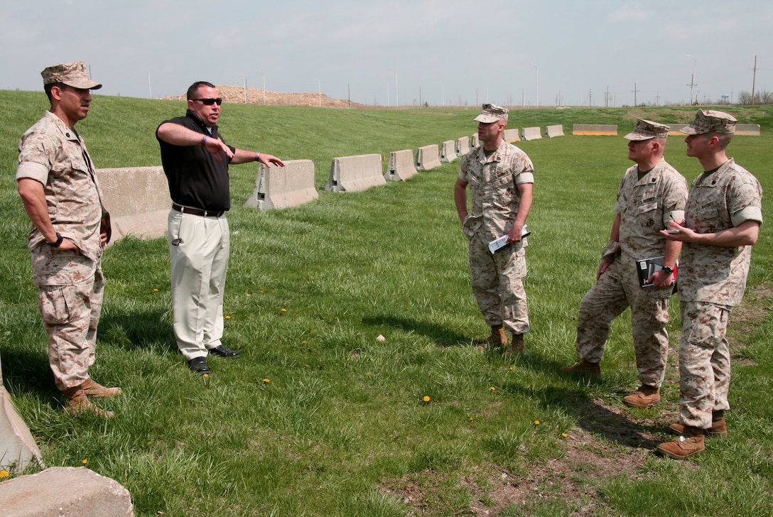 Dennis Sheeley (2nd from left), an antiterrorism analyst at Marine Forces Reserve Headquarters in New Orleans, explains physical security measures to Marine Corps antiterrorism officers during a small-group practical application exercise here April 6.  Active duty and reserve Marines from more than 30 MARFORRES units came here for a week-long Level II AT certification training program.