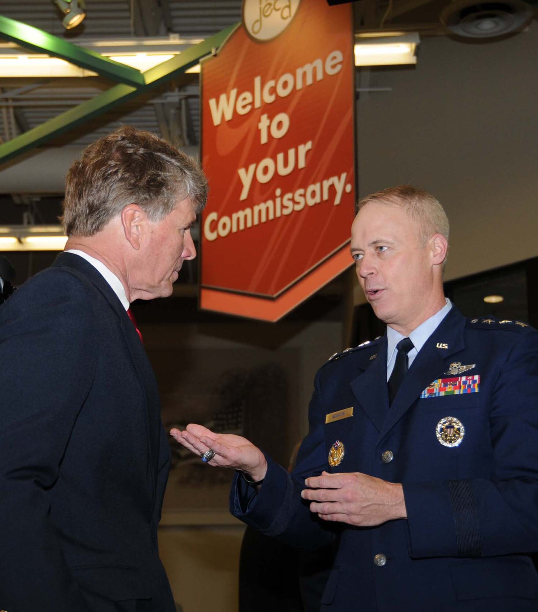 Mississippi Congressman Gene Taylor, left, talks with Lt. Gen. Richard Newton III, president of the Army and Air Force Exchange Service Board of Directors after the April 6 ribbon cutting for Keesler's new shopping complex.  In addition to the commissary, the $60 million structure includes a base exchange, pharmacy, food court, optical shop, GNC, a variety of concessionaires and beauty, nail and barber shops.  (U.S. Air Force photo by Kemberly Groue)
