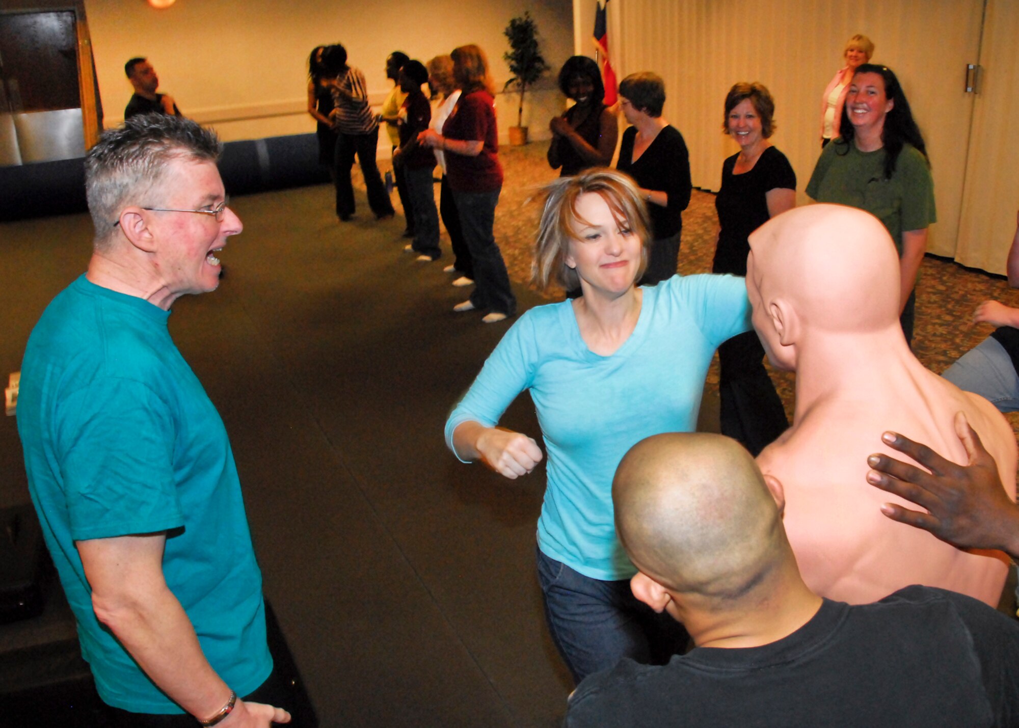 Attendees line up to learn some self-defense options at Speak Up and Speak Out in the Midwestern State University Clark Student Center April 6, 2010.  Sheppard Air Force Base and MSU worked together and brought an entire day of workshops to help prevent sexual assault.  Topics included self-defense for men and women, by-stander intervention, sexual harrassment, online predators, violence and others.  (U.S. Air Force photo/Harry Tonemah)