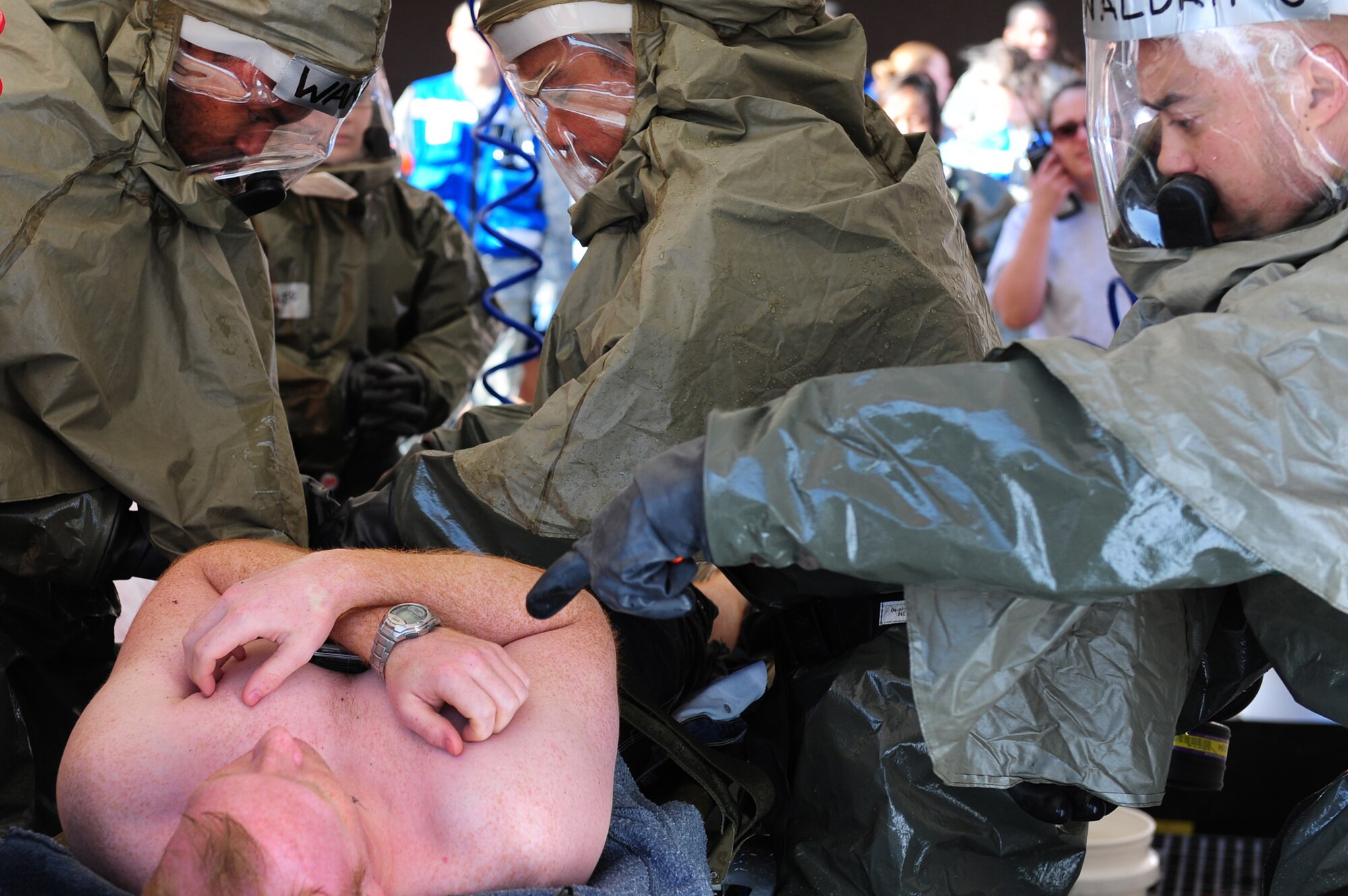 NELLIS AIR FORCE BASE, Nev. -- 
Airmen from the 99th Medical Group wash a contaminated patient in a decontamination tent during an All Hazard Response Exercise March 27.  The All Hazardous Response Exercise tests the abilities of the 99 MDG, when reacting to a mass casualty scenario.  Airmen had to quickly respond to simulated situations to include bomb blast, fires and hazardous contamination. 
(U.S. Air Force Photo by Staff Sgt. William P. Coleman/RELEASED)
