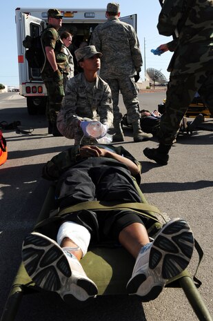 NELLIS AIR FORCE BASE, Nev. -- 
Airman First Class Ulla Stromberg, 99th Medical Group, gives oxygen to a patient during an All Hazardous Response Exercise March 27.  The All Hazard Response Exercise tests the abilities of the 99 MDG, when reacting to a mass casualty scenario.  Airmen had to quickly respond to simulated situations to include bomb blast, fires and hazardous contamination. (U.S. Air Force Photo by Staff Sgt. William P. Coleman/RELEASED)
