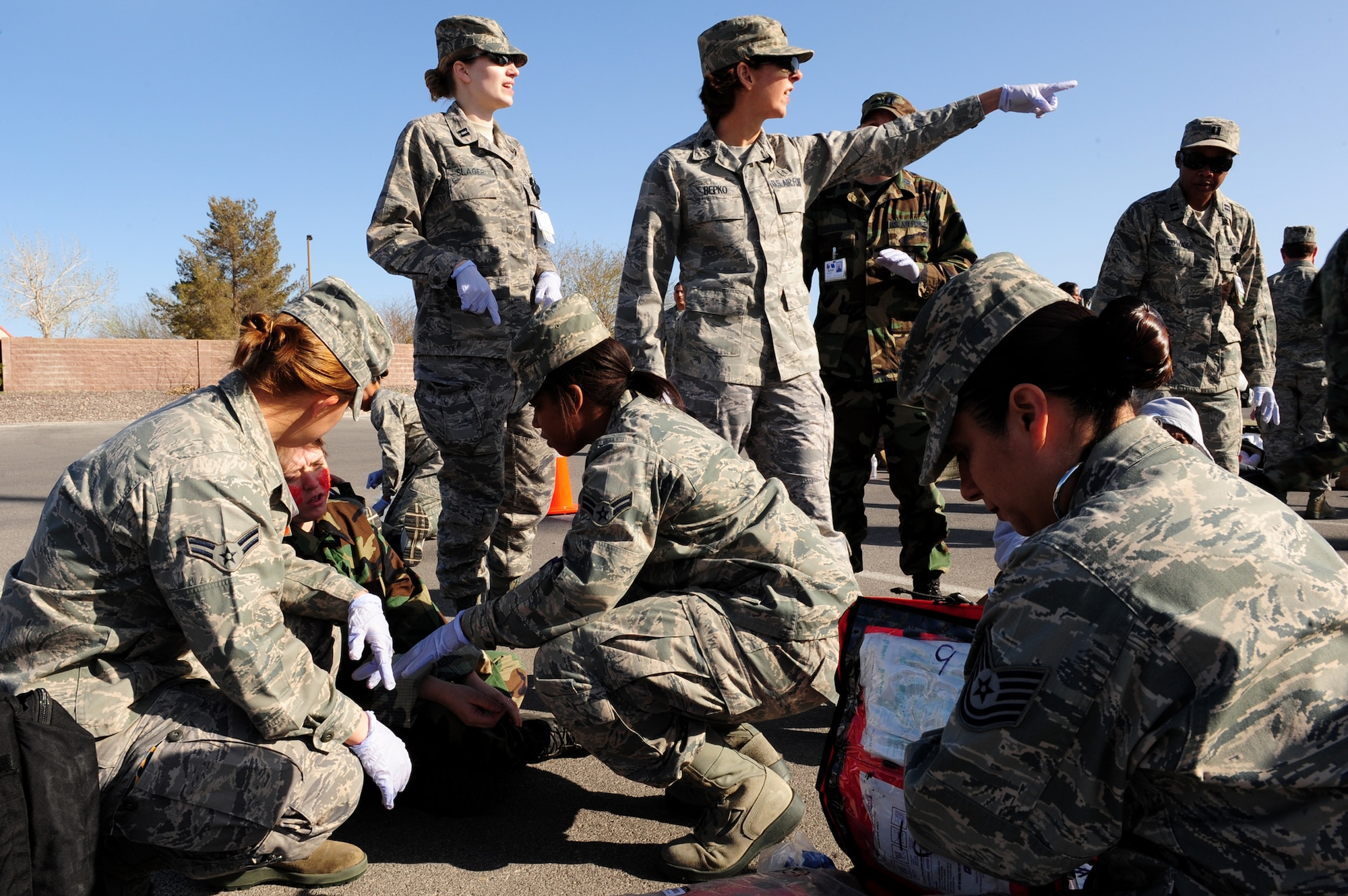 NELLIS AIR FORCE BASE, Nev. -- Airmen from the 99th Medical Group participate in an All Hazardous Response Exercise March 27.  The All Hazard Response Exercise tests the abilities of the 99 MDG when reacting to a mass casualty scenario.  Airmen had to quickly respond to simulated situations to include bomb blast, fires and hazardous contamination. (U.S. Air Force Photo by Staff Sgt. William P. Coleman/RELEASED)
