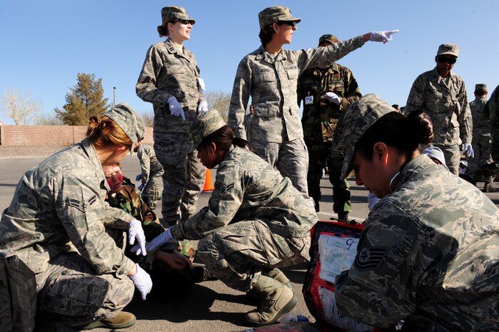 NELLIS AIR FORCE BASE, Nev. -- Airmen from the 99th Medical Group participate in an All Hazardous Response Exercise March 27.  The All Hazard Response Exercise tests the abilities of the 99 MDG when reacting to a mass casualty scenario.  Airmen had to quickly respond to simulated situations to include bomb blast, fires and hazardous contamination. (U.S. Air Force Photo by Staff Sgt. William P. Coleman/RELEASED)
