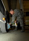 MINOT AIR FORCE BASE, N.D. -- Airman 1st Class Peter Rivera, 5th Logistics Readiness Squadron vehicle operations vehicle operator, cleans the wheels of the shuttle that is was used for Maj. Gen. Floyd Carpeter, 8th Air Force commander. Vehicle operations is one of the many important sections of the 5th LRS Airmen all over the base rely on. (U.S. Air Force photo by Airman 1st Class Ashley N. Avecilla)