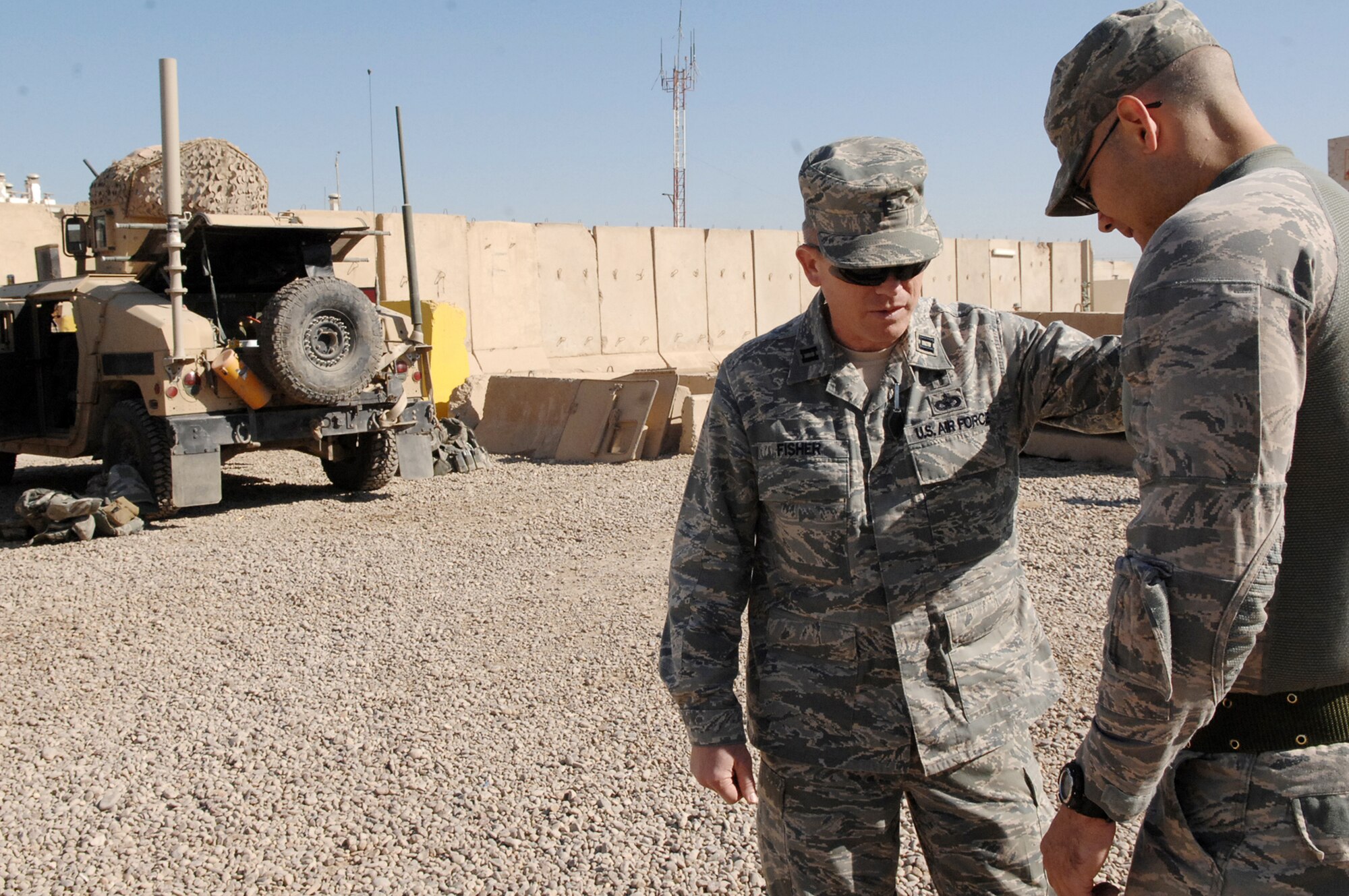 Chaplain (Capt.) Steve Fisher prays with Staff Sgt. Thomas Bonte March 22, 2010 before a mission outside Camp Stryker, Iraq. Chaplain Fisher is the 732nd Air Expeditionary Group chaplain.  Sergeant Bonte is a 732nd AEG Security Forces Squadron vehicle driver. (U.S. Air Force photo/Airman 1st Class Allison M. Boehm)