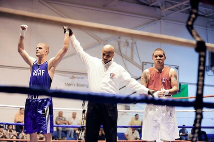 Senior Airman Matt McCoy defeats his opponent during the Air Force Boxing Championships at the Bennett Fitness Center at Lackland Air Force Base, Texas, April 4, 2010. (U.S. Air Force photo/Senior Airman Christopher Griffin)
