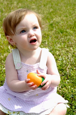 Rebecca Taylor plays with the Easter eggs that she collected during the annual Easter egg hunt on Joint Base Charleston, S.C., April 3, 2010. The event was hosted by Youth Programs, which included a surprise visit from the Easter bunny and prize give-aways. Each field hid one elusive prize egg which contained a blue slip of paper giving each child that found it an Easter basket crammed full of candy and toys.  Rebecca is the daughter of Staff Sgt. Joseph Taylor who is with the 315th Security Forces Squadron.  (U.S. Air Force Photo/Airman 1st Class Lauren Main)