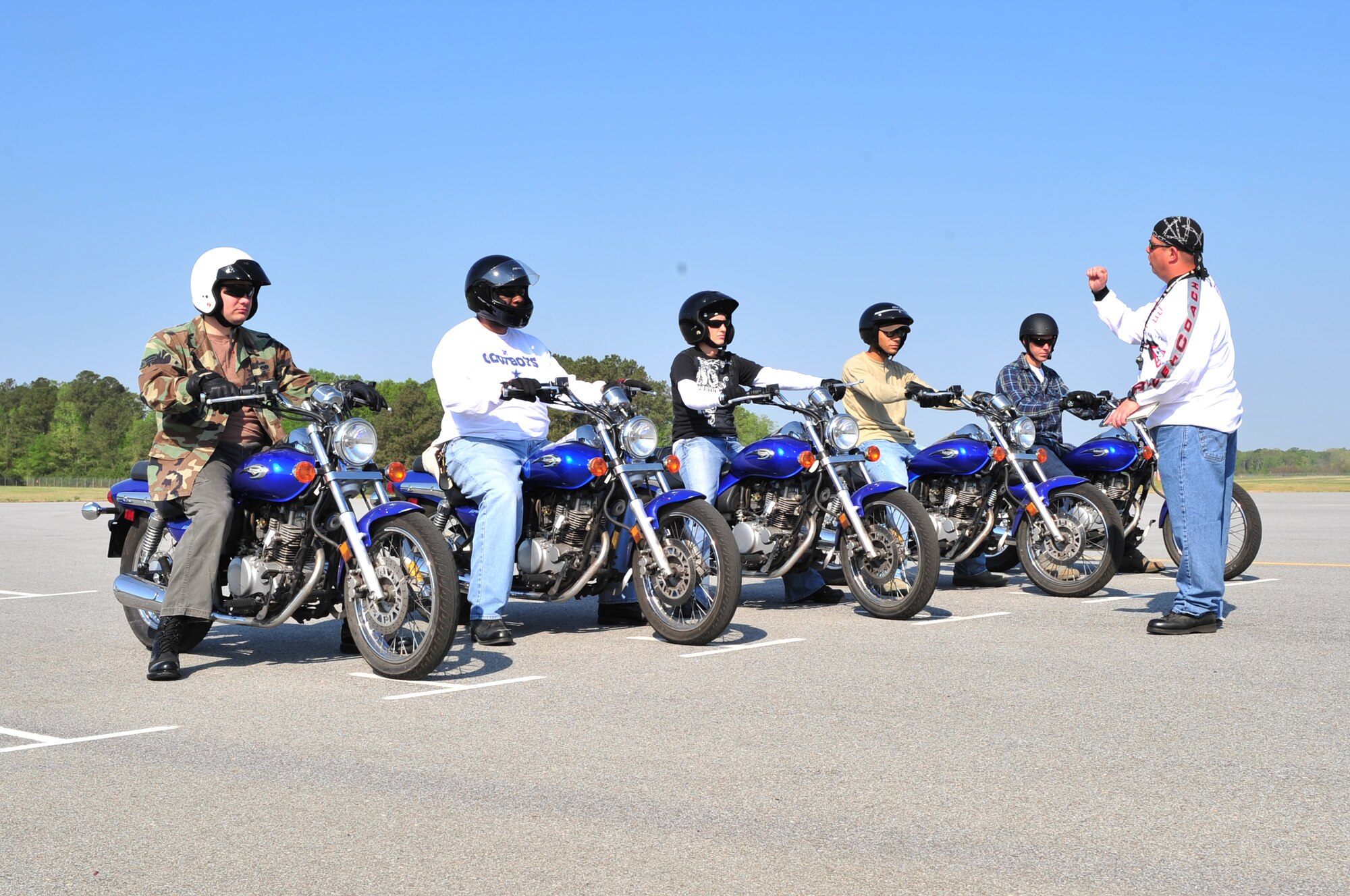 SEYMOUR JOHNSON AIR FORCE BASE, N.C. -- Master Sgt. Mike Muraco, mortorcycle rider coach, explains the next maneuver the students will practice during the Basic Riders Course here, April 6, 2010. This course is mandatory for all Department of Defense personnel who operate motorcycles on or off base. Sergeant Muraco hails from Lake Station, Ind. (U.S. Air Force photo/Senior Airman Rae Perry)