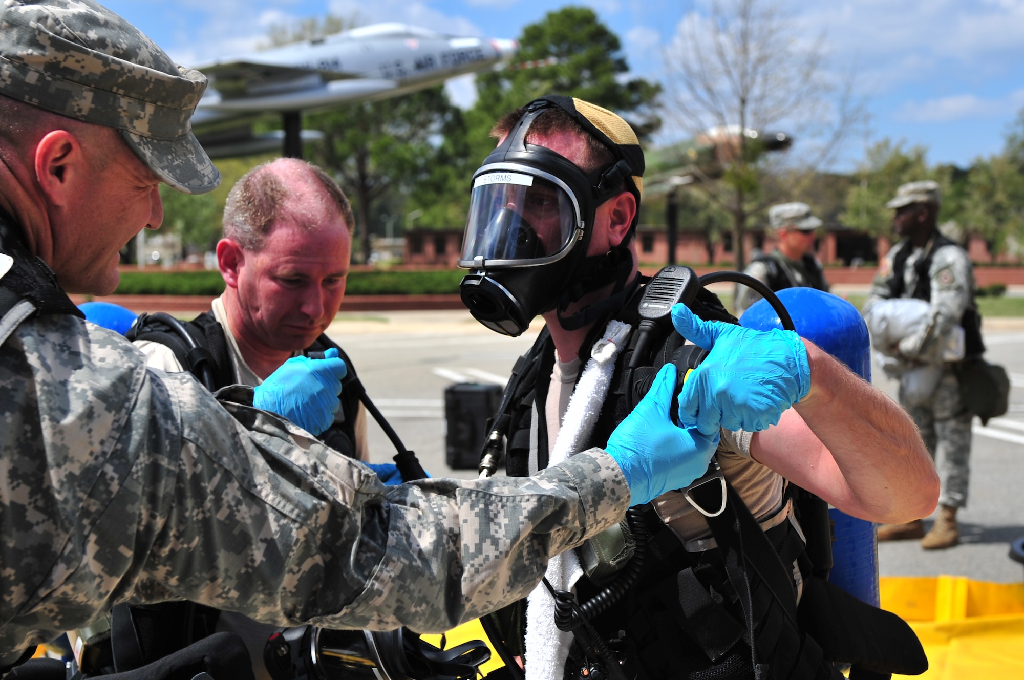 SEYMOUR JOHNSON AIR FORCE BASE, N.C. -- Army Sgt. James Storms has his self-contained breathing apparatus checked by Army Sgt. 1st Class Robert Johnson before removing it during an initial survey of a chemical, biological, radiological and nuclear hazard exercise here, March 30, 2010. Sergeant Johnson checks and records how much air is left in the tank and if it is reusable. Sergeant Storms, a logistics NCO with the 42nd Civil Support Team North Carolina National Guard, is from Clayton. Sergeant Johnson, an information systems NCO with the 42nd CST North Carolina National Guard, hails from Rocky Mount. (U.S. Air Force photo/Senior Airman Rae Perry)
