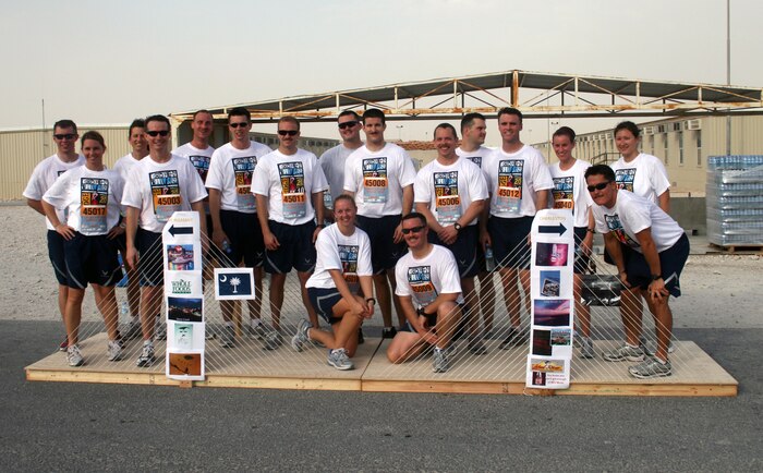 Members of the 14th Airlift Squadron, currently deployed as the 816th Expeditionary Airlift Squadron to the Middle East, join for a group photo March 27, 2010, on a makeshift replica of the Arthur Ravenel Jr. Bridge. The team of Airmen participated in their own deployed version of Charleston's famed Cooper River Bridge Run, complete with T-shirts, a miniature bridge and printouts from local sponsors. The 14 AS is scheduled to redeploy to Charleston this spring. (Courtesy photo)