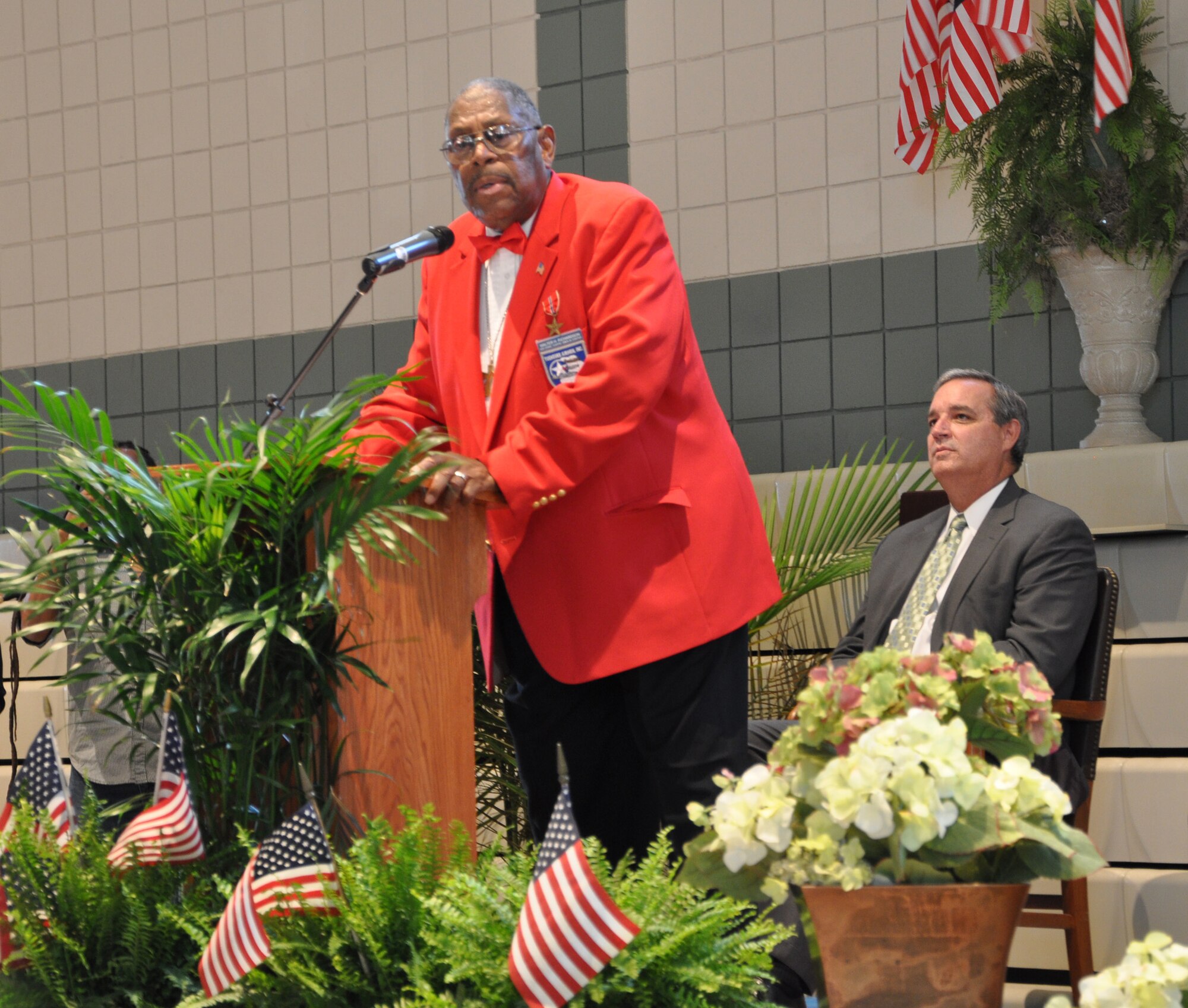 Chief Master Sgt. (Ret) Walter Richardson, addresses the crowd after accepting a Congressional Gold Medal from Congressman Jeff Miller April 6 at St. Mary's Catholic Church in Fort Walton Beach, Fla.  Chief Richardson joined the military in 1949 and served in the infamous "Tuskegee Airmen," an Army Air Corps program that trained African Americans to fly and maintain combat aircraft. Later in Chief Richardson's career, he served as an aircraft mechanic at Eglin and retired from Hulburt Field.  (U.S. Air Force photo/Chrissy Cuttita)