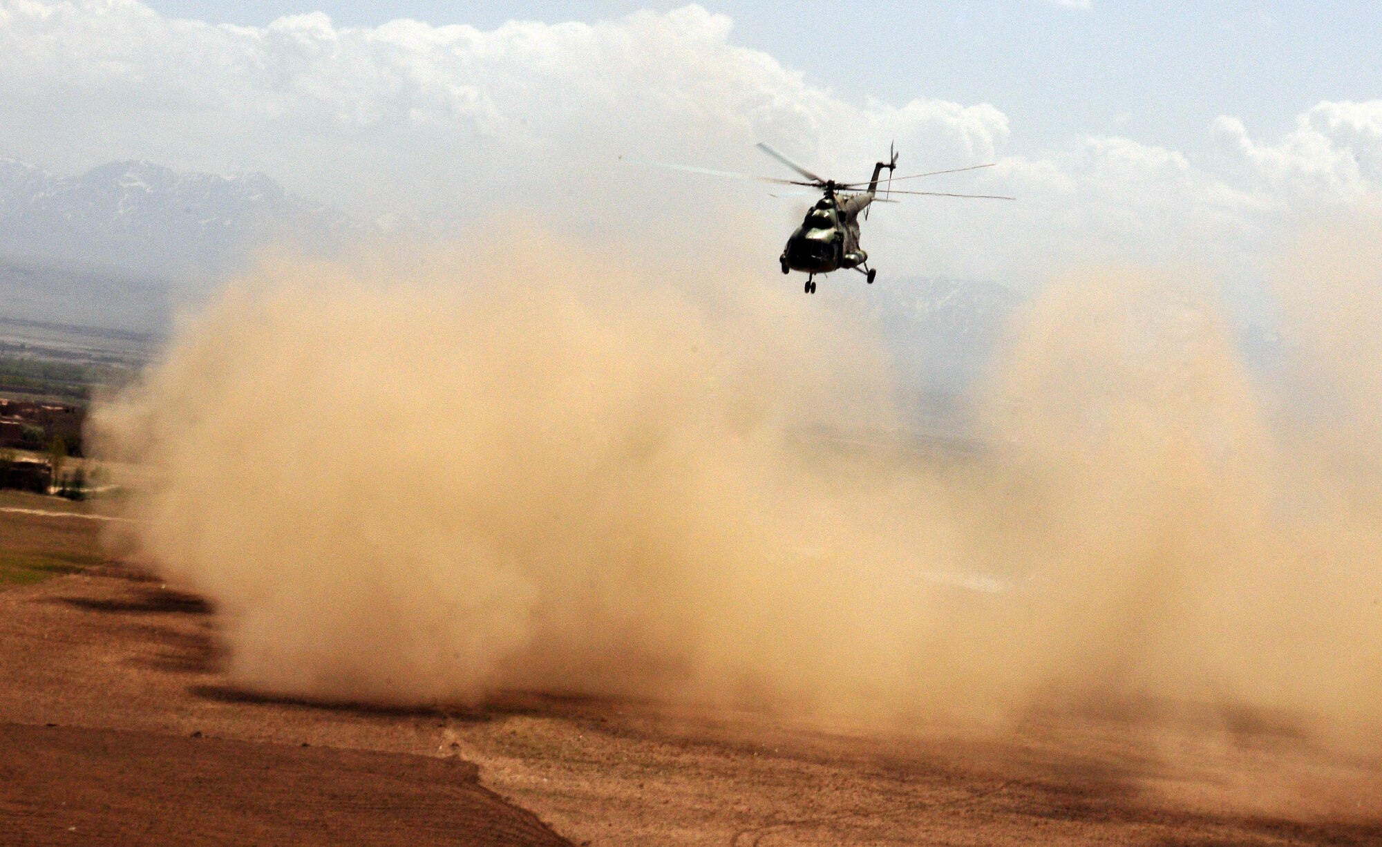 An Afghan National Army Air Corps Mi-17 helicopter lifts off after an air-assault mission involving the Afghan 6th Commando Kandak April 1, 2010, in the Pul-e Alam district of the Logar region. The mission disrupted insurgent activity to bring stability to the population and the region. (US Navy photo by Mass Communication Specialist 2nd Class David Quillen/ RELEASED)