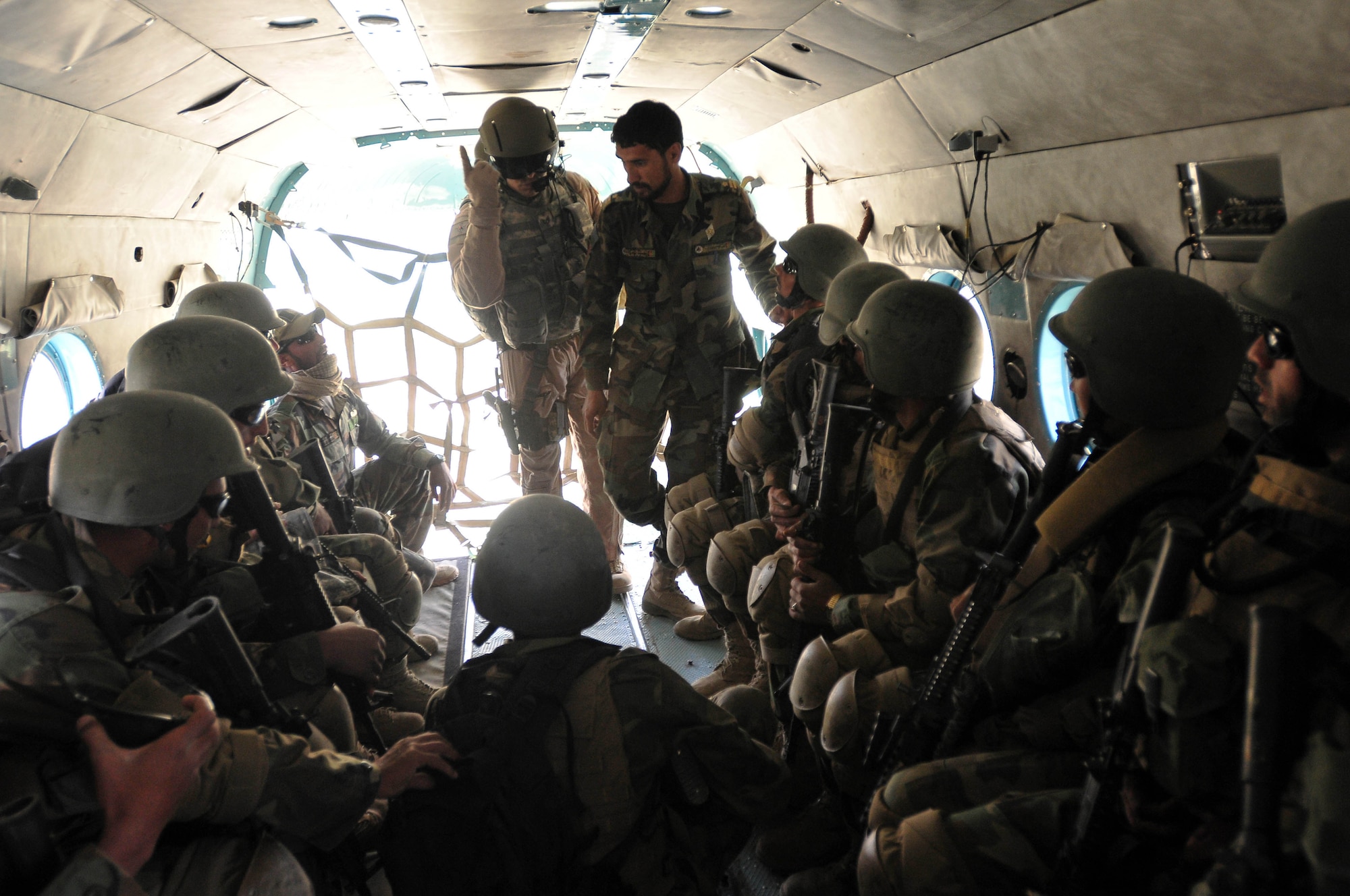Afghan commandos from the 6th Commando Kandak practice infiltration techniques using an Afghan National Army Air Corps Mi-17 helicopter April 1, 2010, at Camp Morehead near Kabul, Afghanistan. (US Navy photo by Mass Communication Specialist 2nd Class David Quillen/ RELEASED)