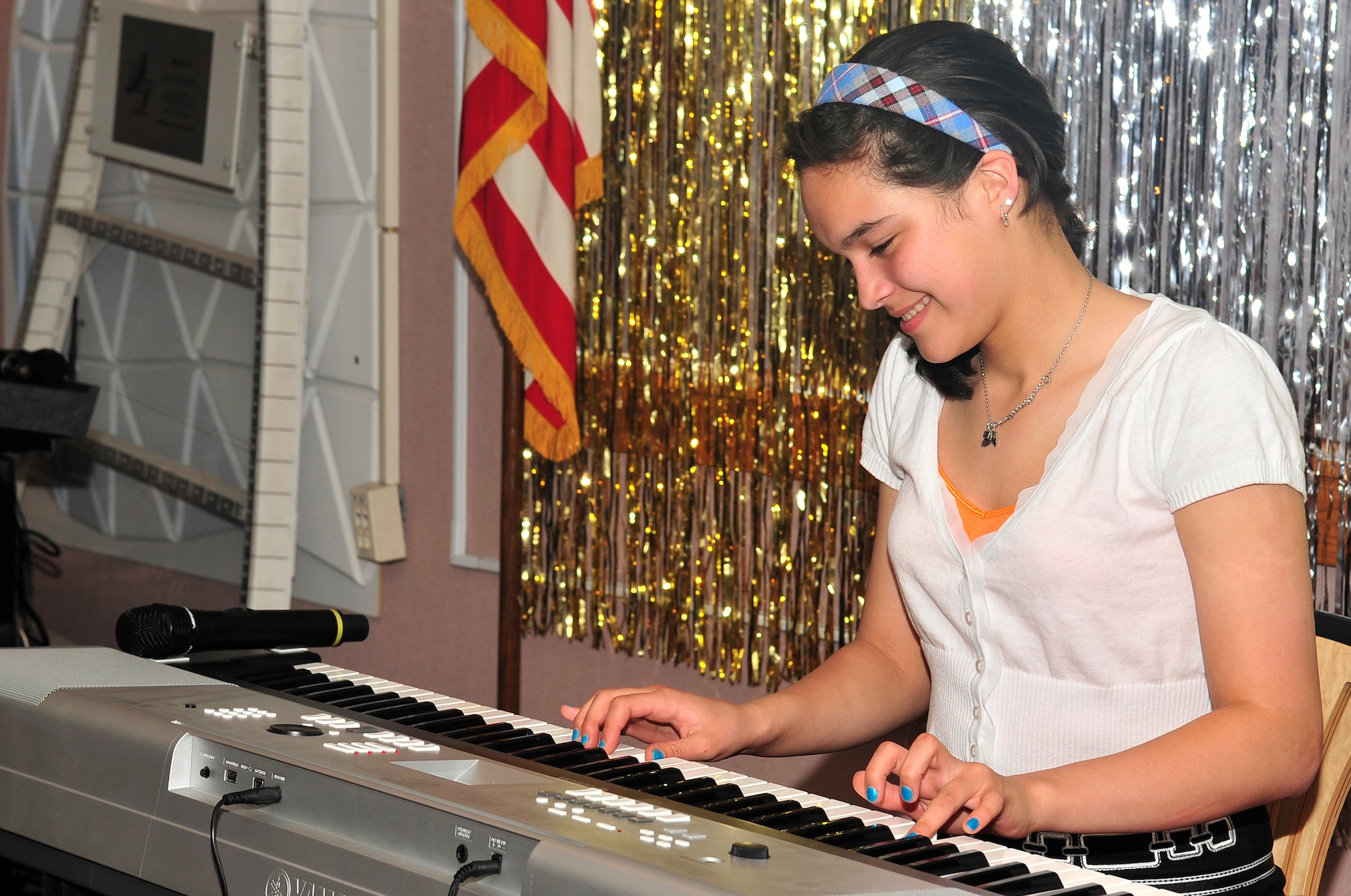 16-year-old Ana Thibodeau performs “Sonatina 1” for piano during Buckley’s “You Got Talent!” competition finale March 30. First-place winners at the Air Force level will be invited to perform with Tops in Blue when the team visits the winners’ installation. (U.S. Air Force photo by Airman 1st Class Manisha Vasquez)