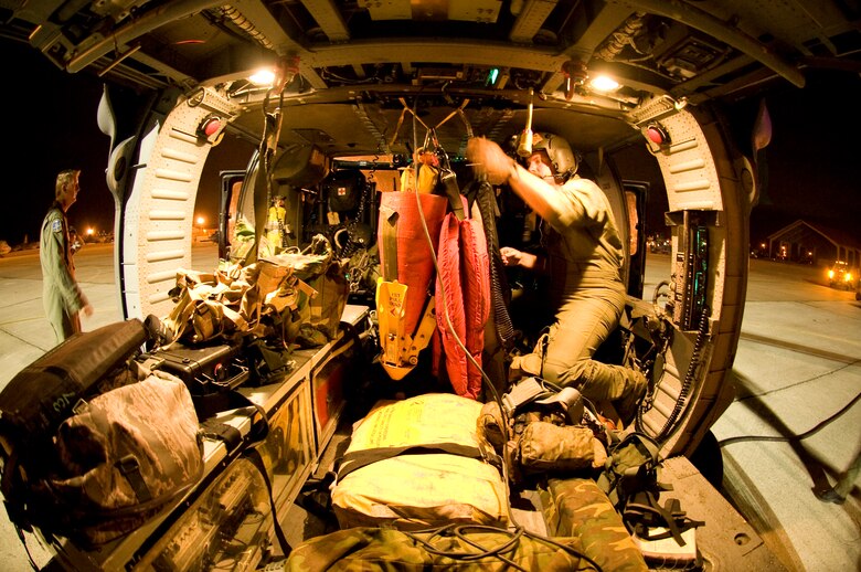 PATRICK AIR FORCE BASE, Fla. -  Equipping the HH-60G Pave Hawk helicopter for a shuttle launch is a long process complete with hundreds of pounds of gear to be loaded and stowed on board. All of the medical gear would be used in case of an emergency where an astronaut had to bail out of the shuttle either over the ocean or land. The Reservists here provide support for all shuttle and rocket launches. Not only are the crews of the helos the eyes and ears of the shuttle launches, but the HC-130P/N Hercules planes are also used as backup for mid-air refueling and another platform for live-saving measures. All reservists here are combat search and rescue trained and are ready at a moment's notice to provide assistance as needed.  (U.S. Air Force photo/Master Sgt. Rob Grande)