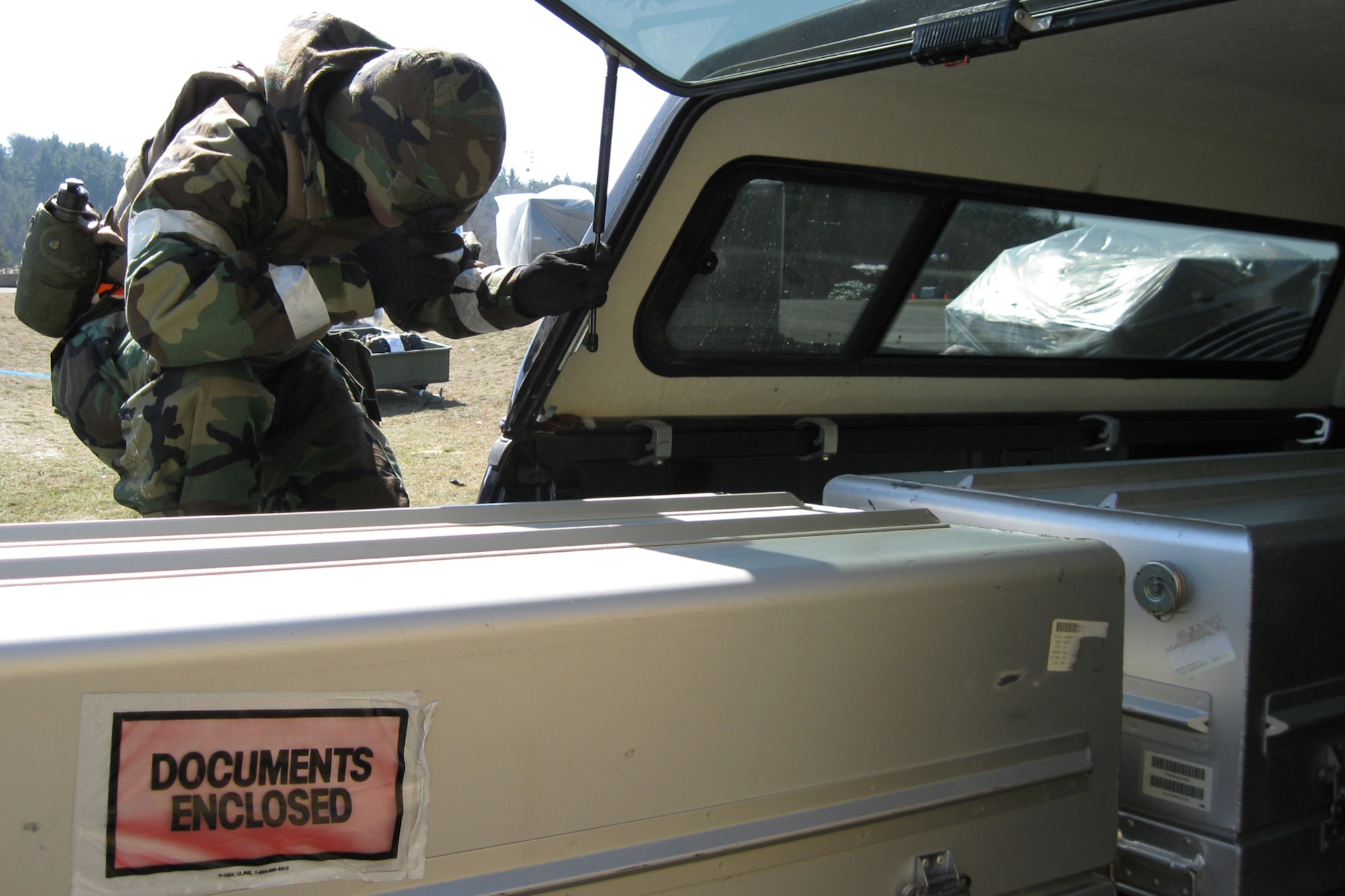 VOLK FIELD ANGB, Wisc., --  An Airman pauses to pay respects as he loads a simulated casket into a vehicle during a recent operational readiness inspection at Volk Field, Wisc. Moving casualties is a tasking that any service member may be tasked to assist with. Reservists from Grissom and Guardsmen from Martinsburg, W.V., teamed together for the inspection which tested numerous wartime skills. (U.S. Air Force photo/Staff Sgt. Ben Mota)