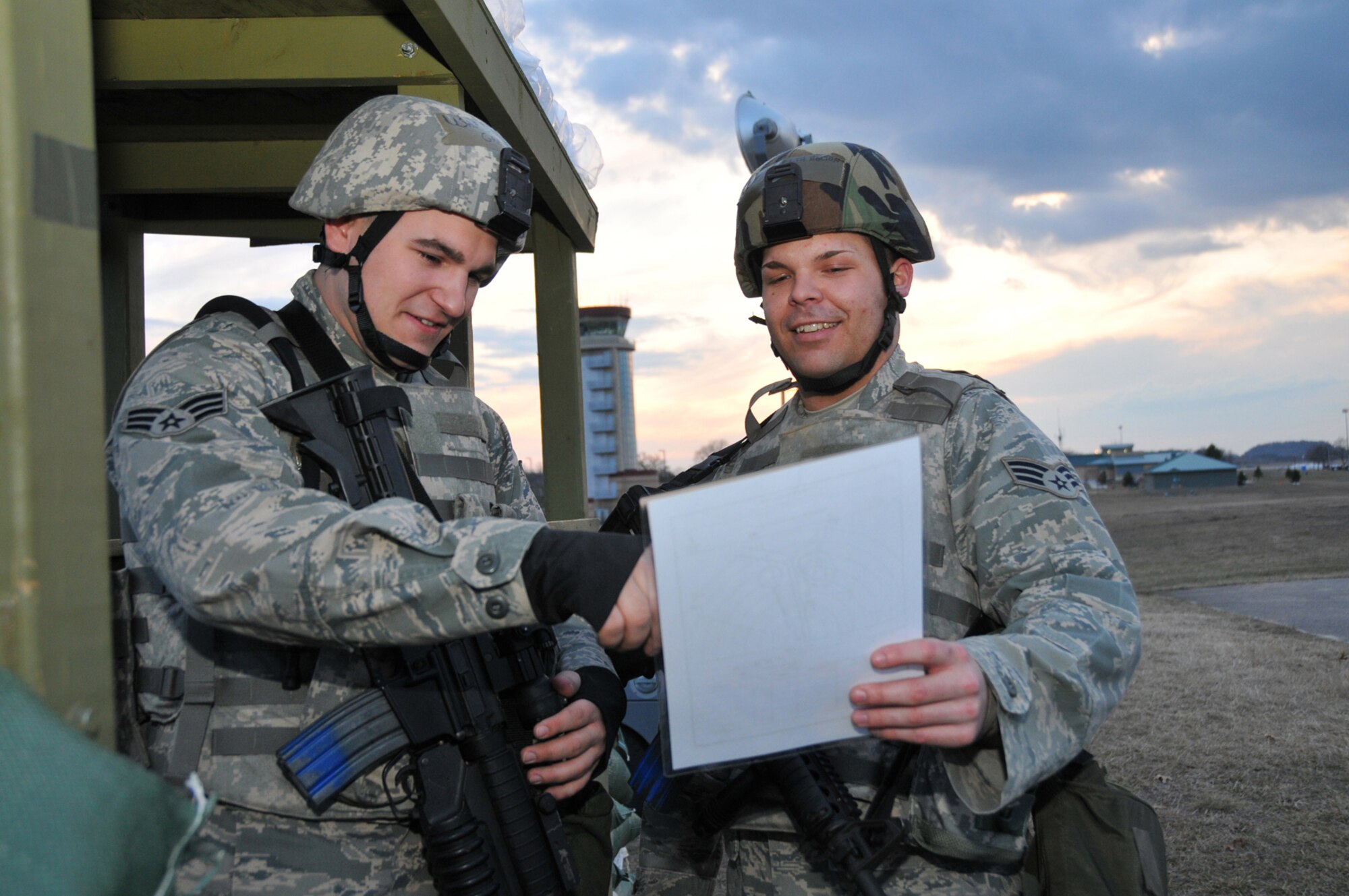 VOLK FIELD ANGB, Wisc., --  Security Policemen Senior Airman Josh Green and Senior Airman Keith Holton, study a range map at Volk Field, Wisc.. The scenario was part of an operational readiness inspection for Airmen from Grissom Air Reserve Base, Ind., and Martinsburg W.V. Air National Guard. (U.S. Air Force photo/Master Sergeant Emily Beightol-Deyerle)