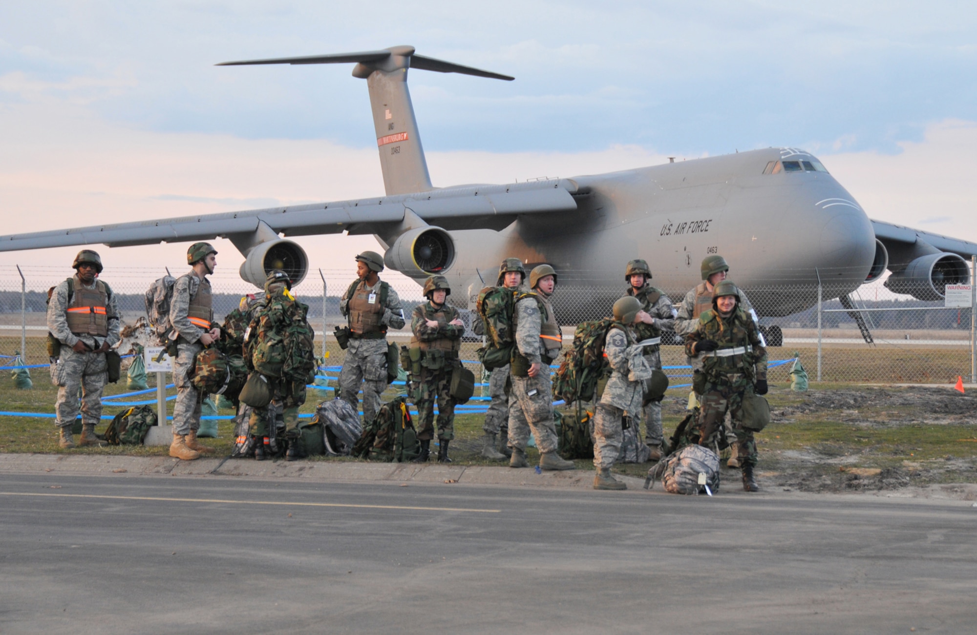 VOLK FIELD ANGB, Wisc., -- Airmen from Grissom Air Reserve Base, Ind., and Martinsburg, Air National Guard Base, W.Va., wait for a bus at the end of their duty day during an operational readiness inspection. (U.S. Air Force photo/Master Sergeant Emily Beightol-Deyerle)