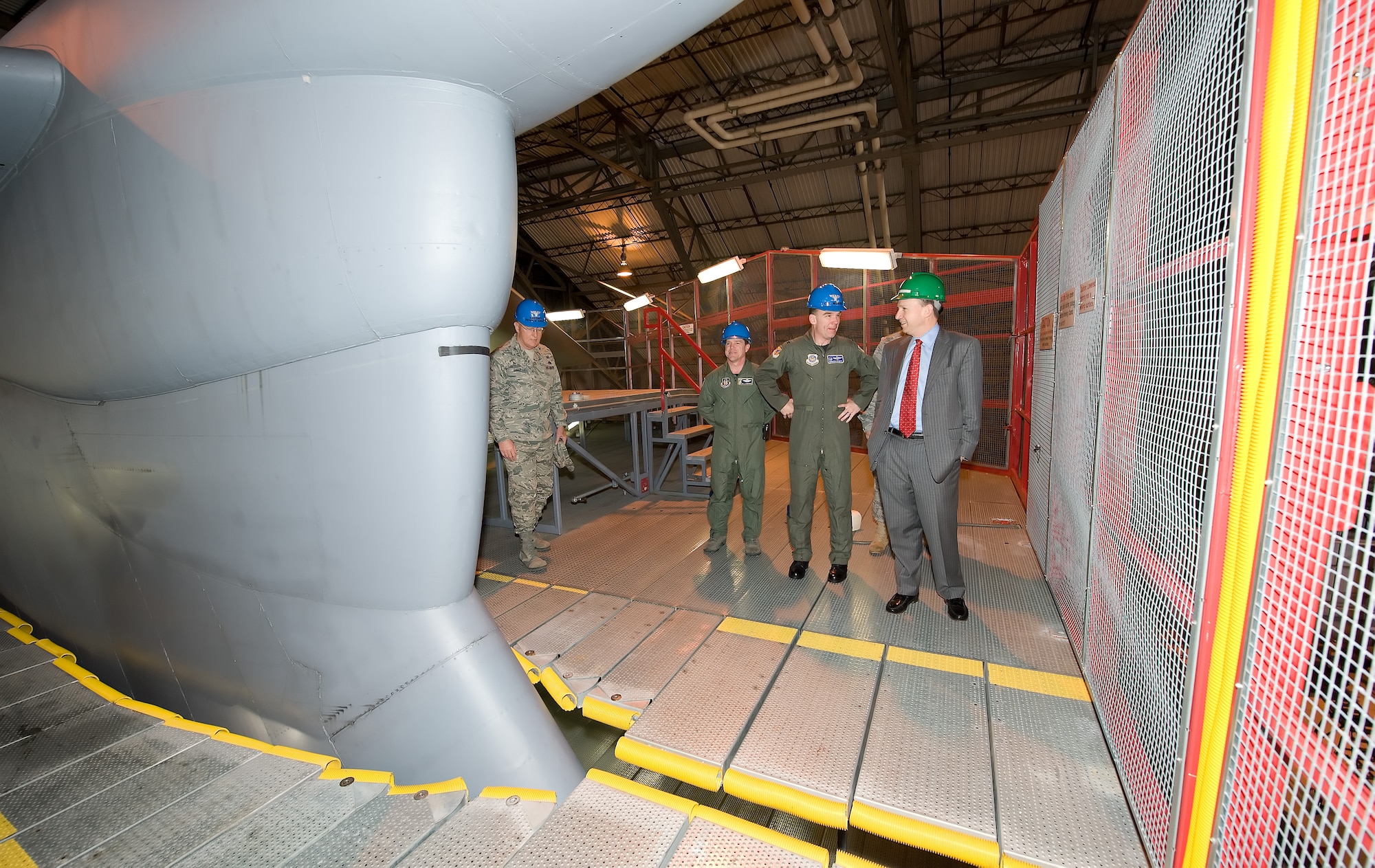 (Center) Colonel Manson Morris, 436th Airlift Wing commander, gives Gov. Jack Markell a tour of the ISO Dock at Dover April 1.  (U.S. Air Force photo/Jason Minto)