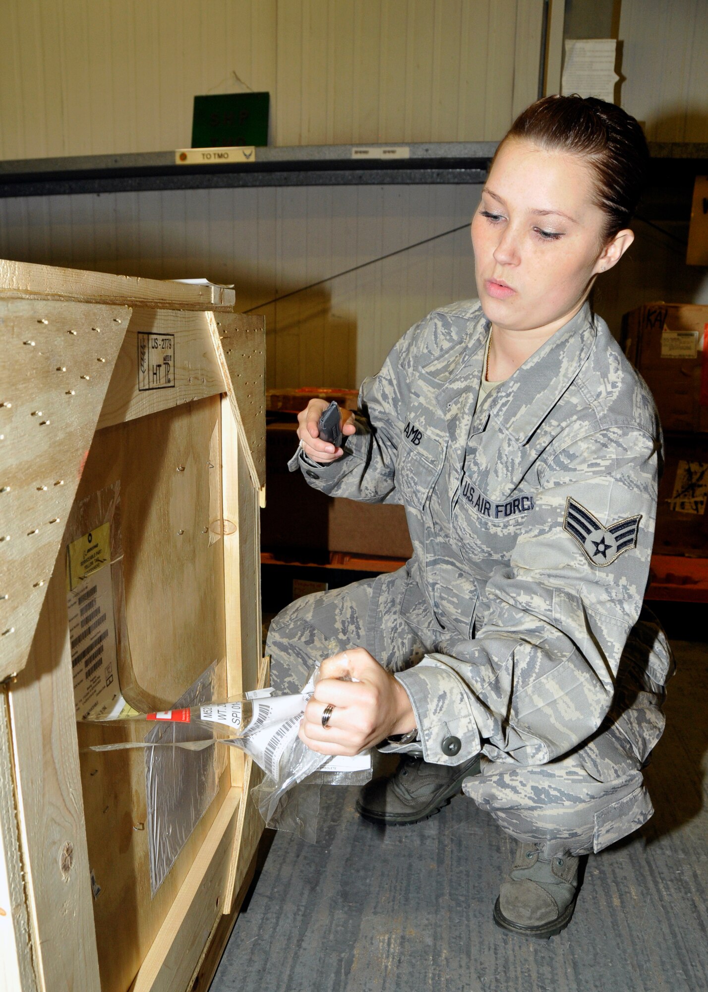 Senior Airman Meghan Lamb,48th Logistics Readiness Squadron flight service journeyman, ensures labels are correct on inbound parts at RAF Lakenheath, England, April 6. Airman Lamb was nominated for a liberty spotlight because she displays 'Integrity First'. (U.S. Air Force photo/Airman First Class Eboni Knox)