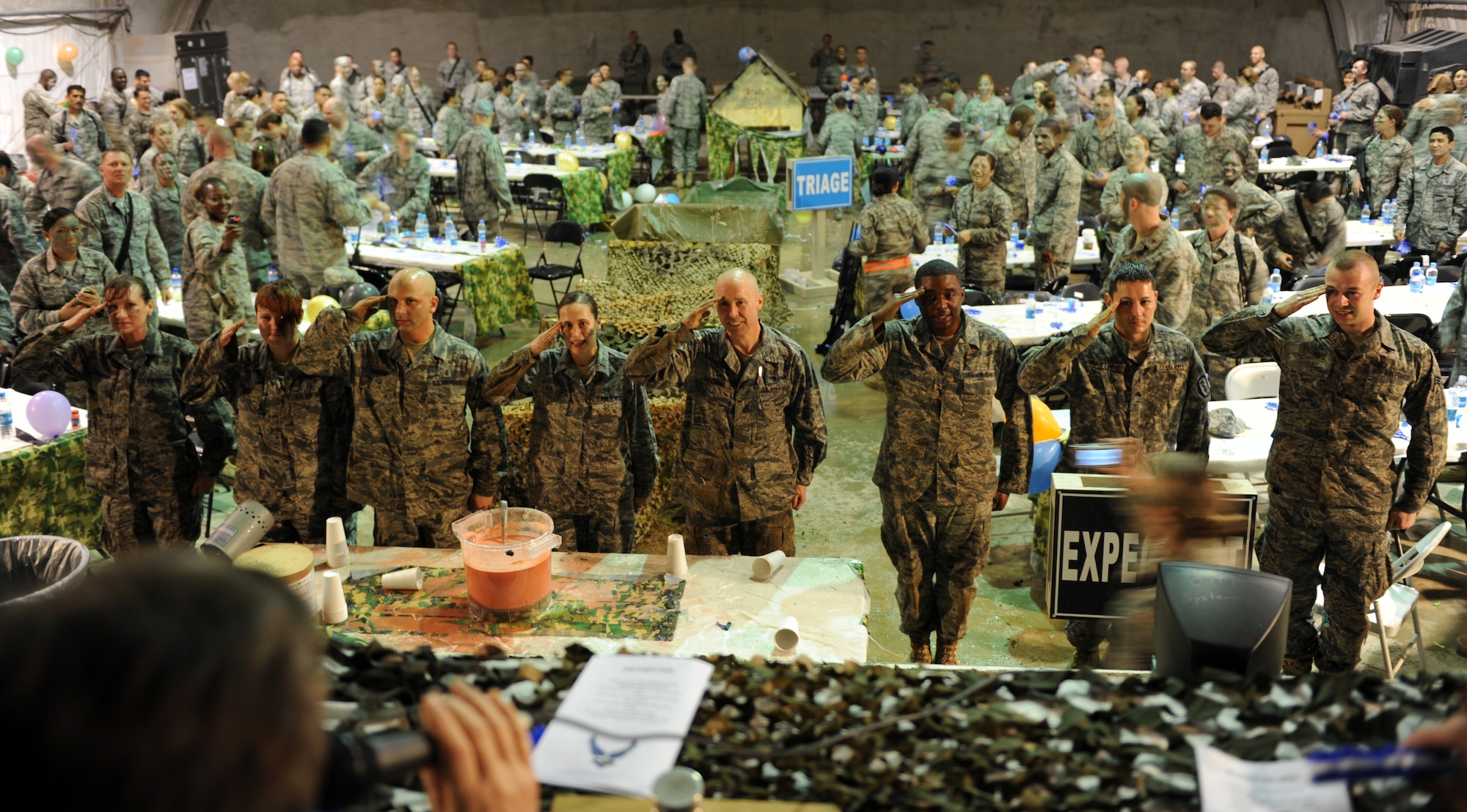 Colonel Joseph Chozinski, 455th Expeditionary Medical Group/Task Force Medical East, commander, leads salute to the head table during the the 455th EMDG/TF MED-E combat dining in here, March 31, 2010. Colonel Chozinski is deployed from Luke Air Force Base, Ariz. (U.S. Air Force photo by/ Staff Sgt. Richard Williams)  