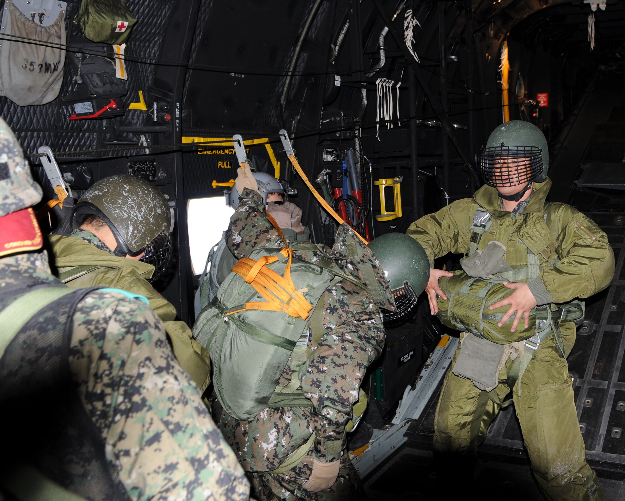 OVER MAE SAN RI, Republic of Korea -- A member of the Republic of Korea Army signals for a final equipment check in the back of a 17th Special Operations Squadron MC-130P Combat Shadow here April 2. More than 70 U.S. and ROK Army soldiers jumped from two MC-130P's as part of a friendship jump between the two armies. (U.S. Air Force photo by Tech. Sgt. Aaron Cram)