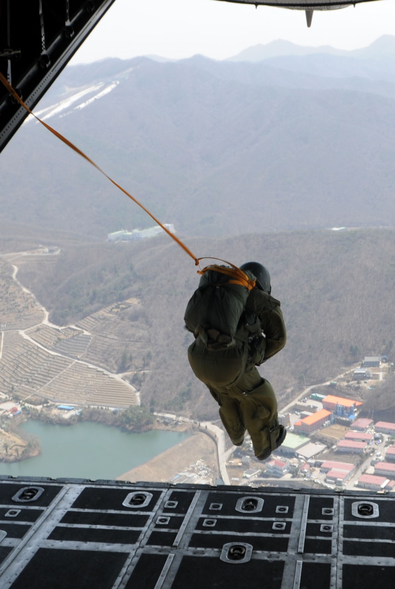 OVER MAE SAN RI, Republic of Korea -- A member of the Republic of Korea Army jumps from the ramp of a 17th Special Operations Squadron MC-130P Combat Shadow here April 2. More than 70 U.S. and ROK Army soldiers jumped from two MC-130P's as part of a friendship jump between the two armies. (U.S. Air Force photo by Tech. Sgt. Aaron Cram)