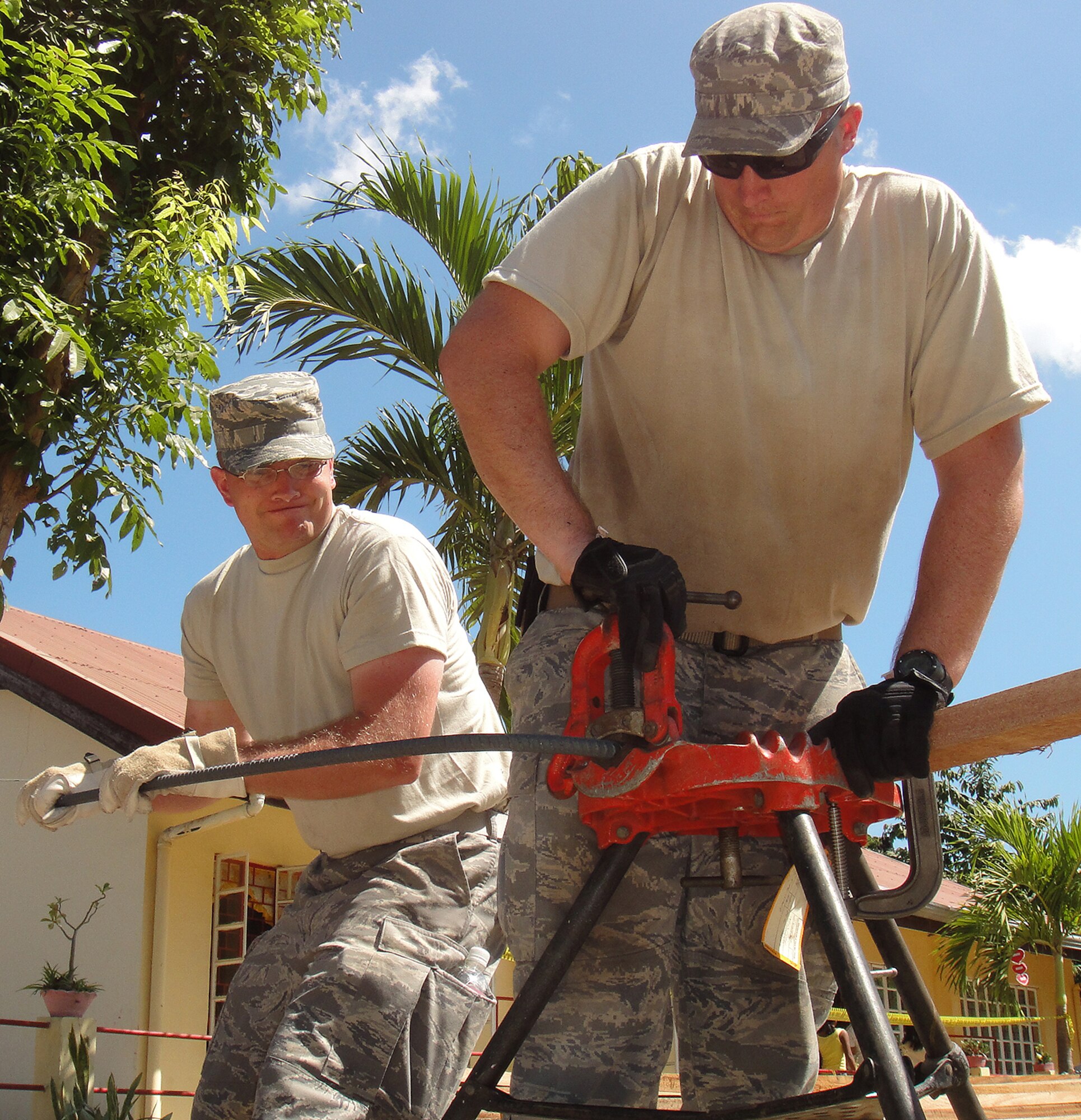 Staff Sgt. Daniel Harris and Tech. Sgt. Jeffrey Martin, both from 18th Civil Engineer Squadron, cut reinforcing bar for the foundation an elementary school complex in Northern Luzon, Philippines during Balikatan 2010. Nearly 30 Kadena civil engineers deployed to the Philippines this spring to build two classrooms for the school that was badly damaged by severe weather. Altogether, U.S. military forces spent $325,000 to build a new healthcare center, build and refurbish old schools and continue construction of a flood wall in the country. (Courtesy photo)