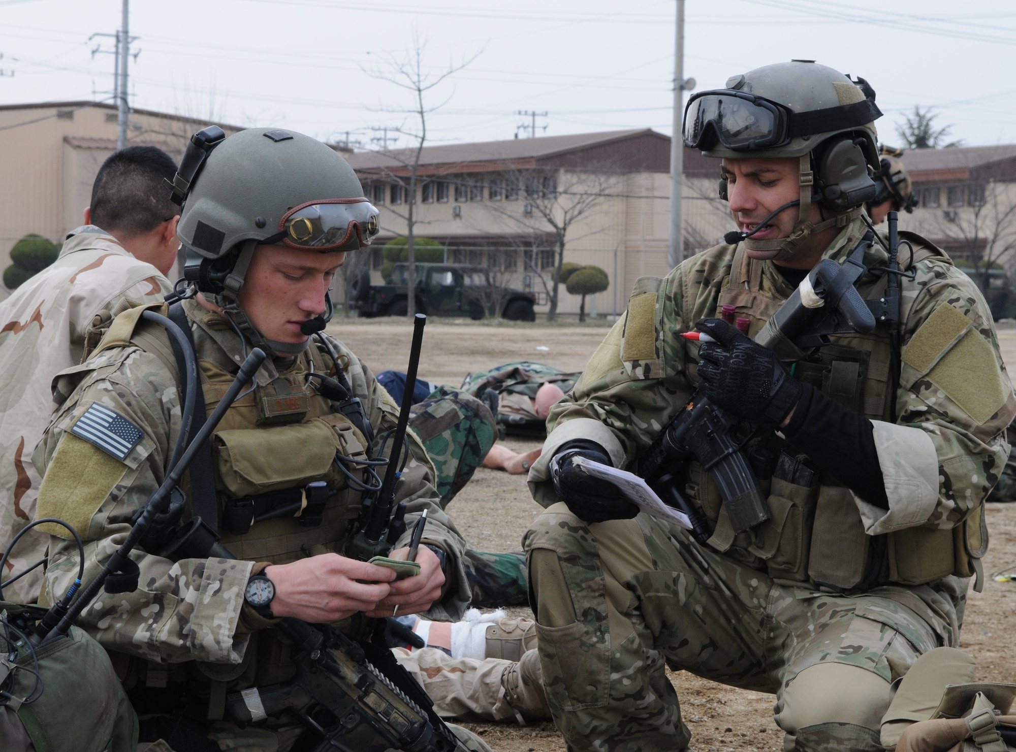 DAEGU AIR BASE, Republic of Korea -- Airmen from the 320th Special Tactics Squadron discuss casualty information during a mass casualty exercise here March 27. The scenario is part of the 353rd Special Operations Group’s annual operational readiness exercise. (U.S. Air Force photo by Tech. Sgt. Aaron Cram)