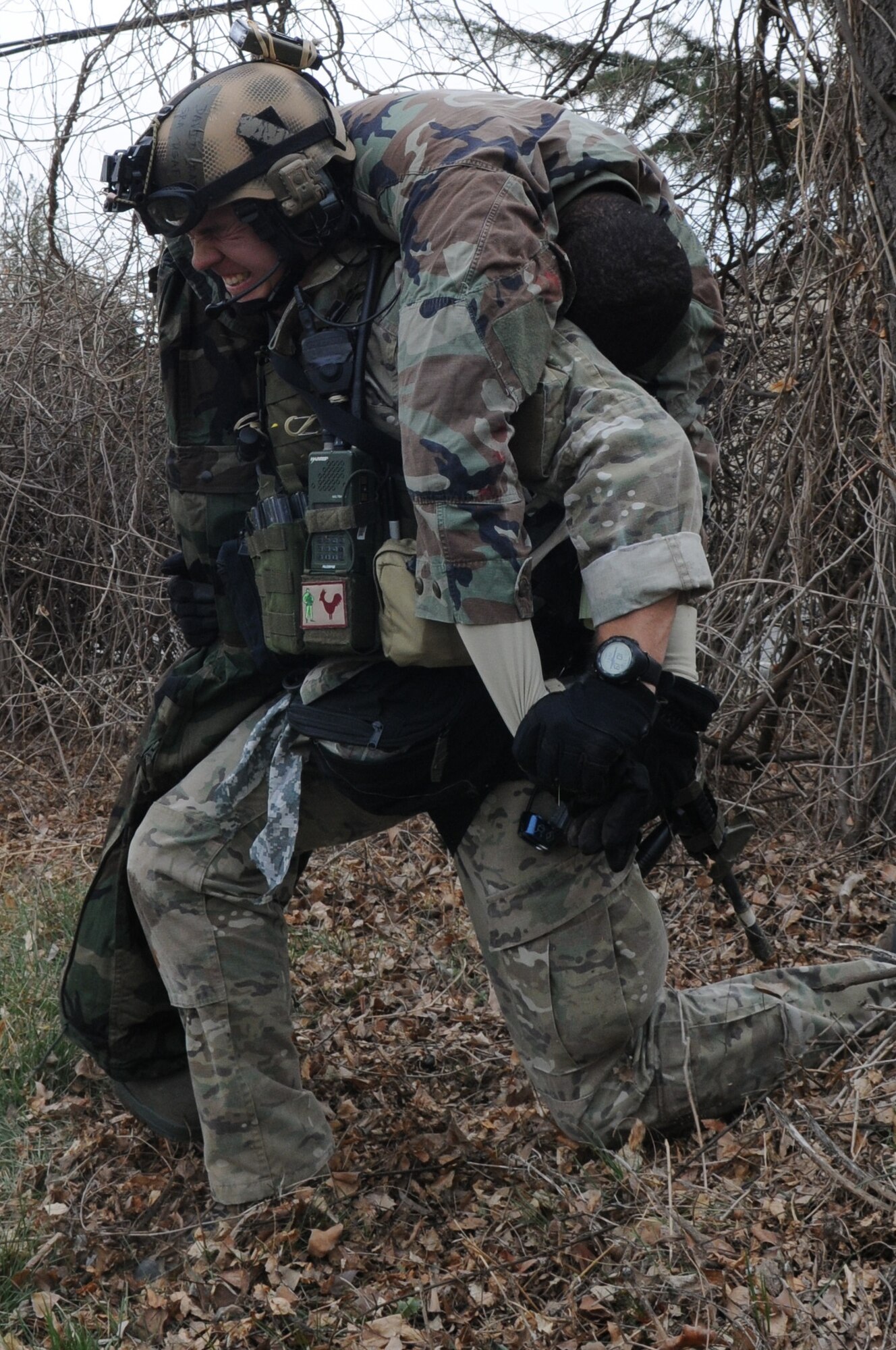 DAEGU AIR BASE, Republic of Korea -- Senior Airman David Craig, a pararescueman from the 320th Special Tactics Squadron, lifts a simulated wounded soldier to take him to the casualty collection point during a mass casualty exercise here March 27. The scenario is part of the 353rd Special Operations Group’s annual operational readiness exercise. (U.S. Air Force photo by Tech. Sgt. Aaron Cram)