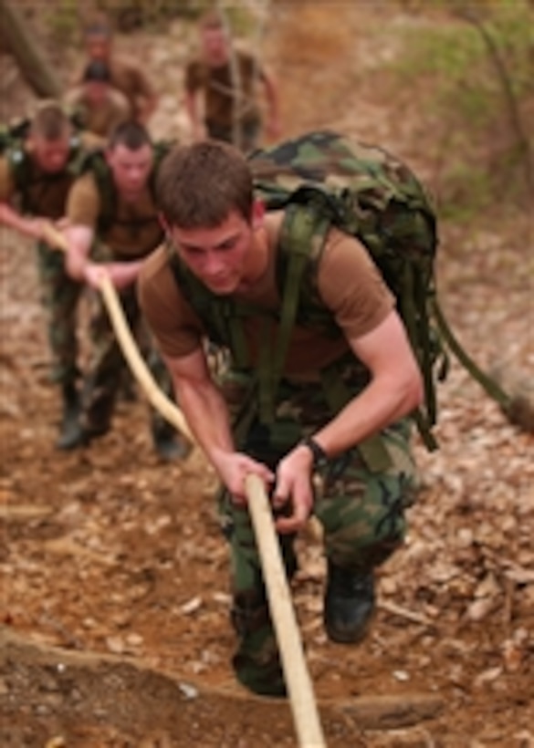 U.S. Naval Academy midshipmen navigate the Marine Corps obstacle course during the Monster Mash Color Competition in Annapolis, Md., on April 3, 2010.  Monster Mash is a long-distance combat conditioning course that emphasizes teamwork, physical strength and endurance.  