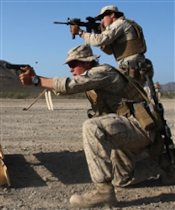 U.S. Marine Corps Lance Cpl. Justin W. Wilson and Sgt. David O. Tye, both with Scout Sniper Platoon, Headquarters and Support Company, Battalion Landing Team, 1st Battalion, 9th Marine Regiment, 24th Marine Expeditionary Unit, fire their weapons at targets during stress shoot relay competition in Djibouti on March 25, 2010.  The contest challenges scout snipers in communication, marksmanship and teamwork during competitive relays.  The 24th Marine Expeditionary Unit is on a seven-month deployment aboard the Nassau Amphibious Ready Group vessels as the theater reserve force for Central Command.  