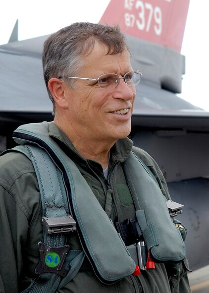 Lee Webber, President and Publisher for The Honolulu Advertiser, describes his F-16 Falcon incentive flight, on the flightline, Joint Base Pearl Harbor Hickam, Hawaii, Apr. 7, 2010. (U. S. Air Force photo/Tech. Sgt. Jerome S. Tayborn)