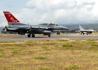 Col. Samuel (Sam) Black, Director of Operations, 100th Fighter Squadron, Air National Guard Alabama,  and Mr. Lee Webber, President and Publisher for The Honolulu Advertiser, taxis onto the runway as they prepare  for  takeoff,  in a F- 16 Falcon, on the flightline, Joint Base Pearl Harbor Hickam, Hawaii, Apr. 7, 2010. (U. S. Air Force photo/Tech. Sgt. Jerome S. Tayborn)