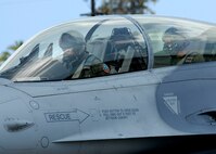 Col. Samuel (Sam) Black, Director of Operations, 100th Fighter Squadron, Air National Guard Alabama, and Lee Webber, President and Publisher for The Honolulu Advertiser, taxis for takeoff,  in an F- 16 Falcon, on the flightline, Joint Base Pearl Harbor Hickam, Hawaii, Apr. 7, 2010. (U.S. Air Force photo/Tech. Sgt. Jerome S. Tayborn)