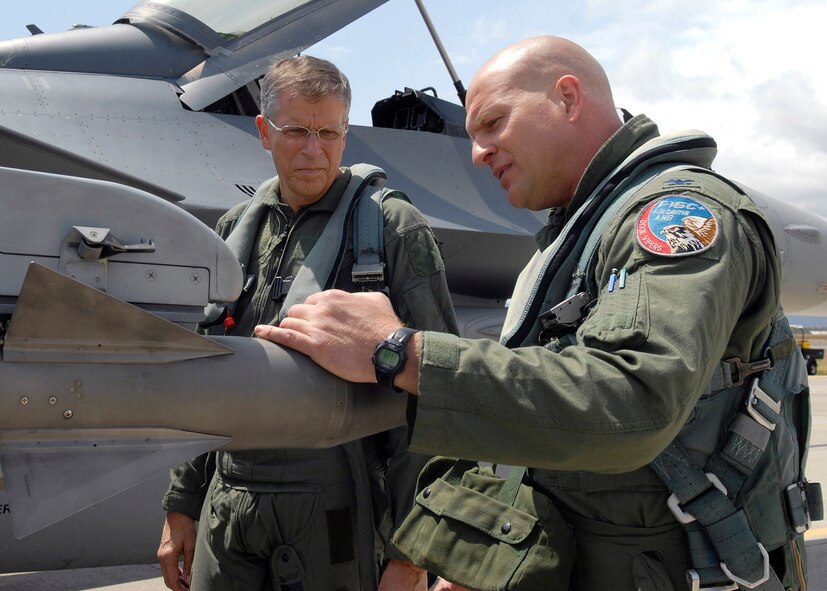 Col. Samuel (Sam) Black, Director of Operations, 100th Fighter Squadron, Air National Guard Alabama, completes his F-16 Falcon preflight checklist, with Lee Webber, President and Publisher for The Honolulu Advertiser, prior to takeoff on the flightline, Joint Base Pearl Harbor Hickam, Hawaii, Apr. 7, 2010. (U. S. Air Force photo/Tech. Sgt. Jerome S. Tayborn)
