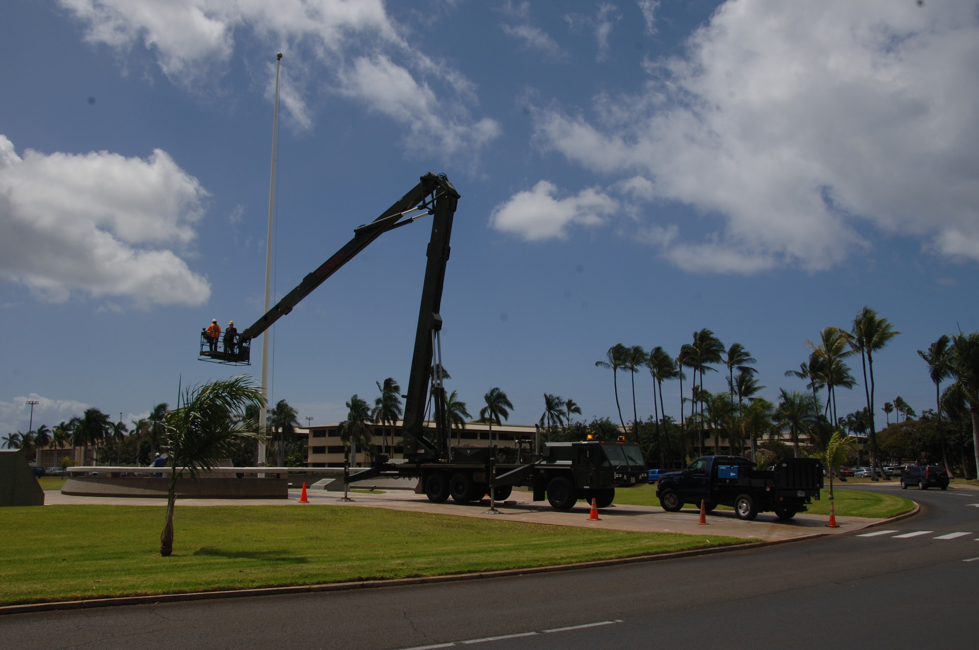 Mr. Art Garde, 15th Civil Engineer Squadron high voltage electrician, removes the "truck" from the flag pole after the wind dislodged it Apr. 6 at Hickam Air Force Base, Hi. (U.S. Air Force photo by Senior Airman Nathan Allen)