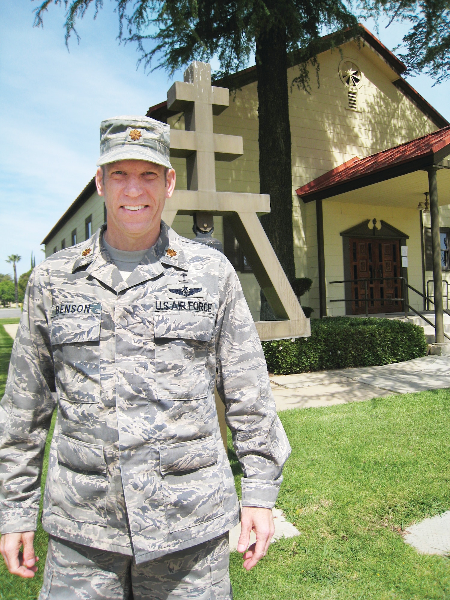 Chaplain (Maj.) Craig Benson stands in front of the base chapel at March Air Reserve Base, April 2.  Chaplain Benson arrived at March ARB last month and is the first of six new Active Guard Reserve chaplains assigned to the most active bases across the United States. (U.S. Air Force Photo/2nd Lt. Zach Anderson)