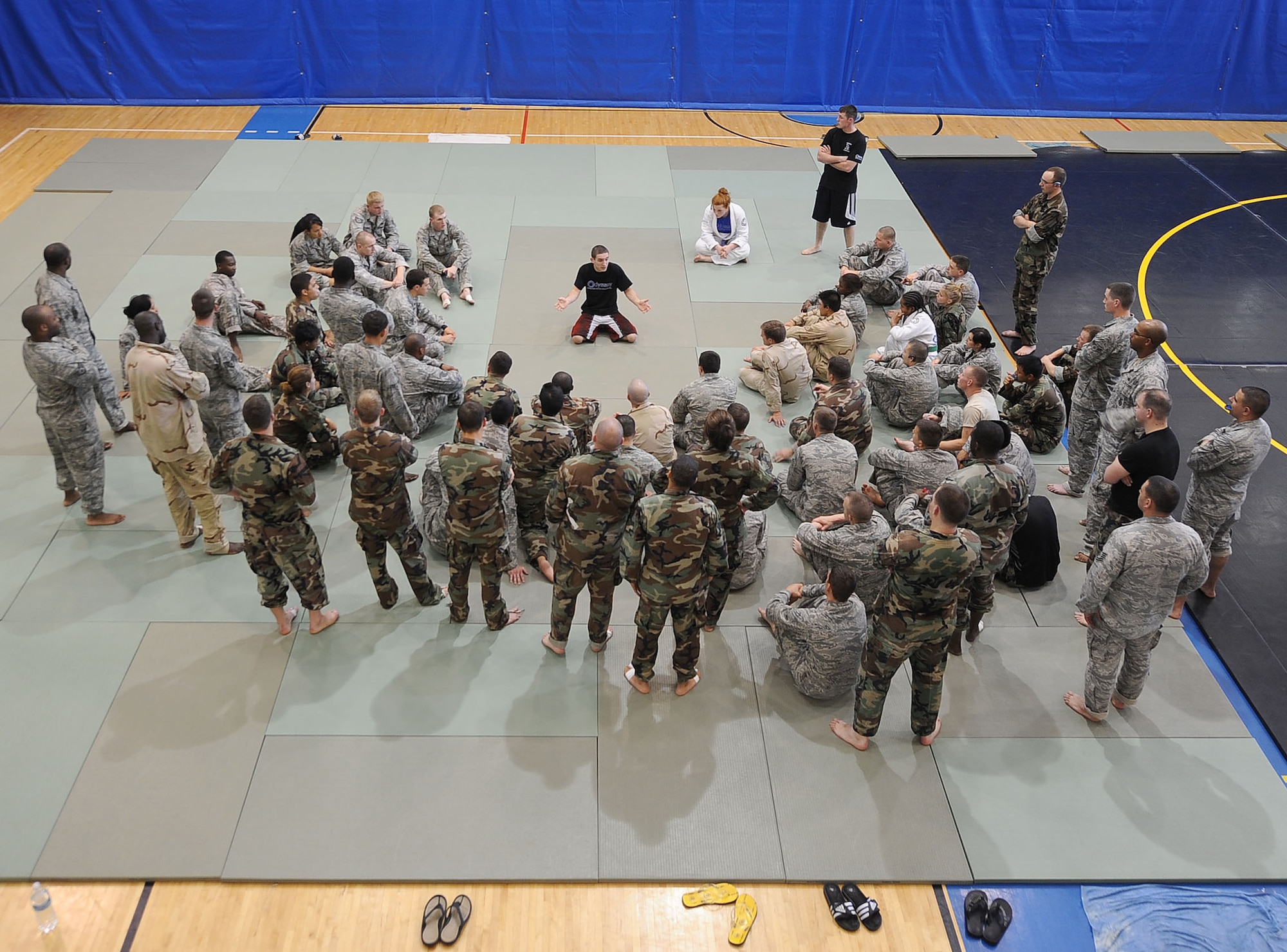 LANGLEY AIR FORCE BASE, Va. -- John Simons,  Modern Army Combatives instructor, provides feedback to students during combatives training April 8. For the first time, Langley and Fort Eustis Service members merged in a session of combatives, which is the Army's version of hand-to-hand combat training. (U.S. Air Force photo/Airman Rebecca Montez)
