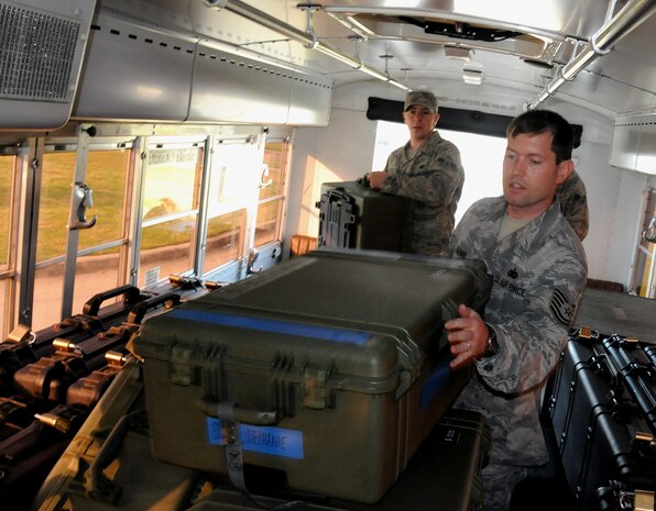 Tech. Sgt. Jeremy Klemme assists Airmen assigned to the 628th Security Forces Squadron with loading equipment on a bus bound for Charleston International Airport April 8, 2010, at Joint Base Charleston, S.C. The equipment will be used to sustain two teams of Airmen at a deployed location in the Middle East. Sergeant Klemme is the unit deployment manager for the 628 SFS. (U.S. Air Force photo/Staff Sgt. Daniel Bowles)