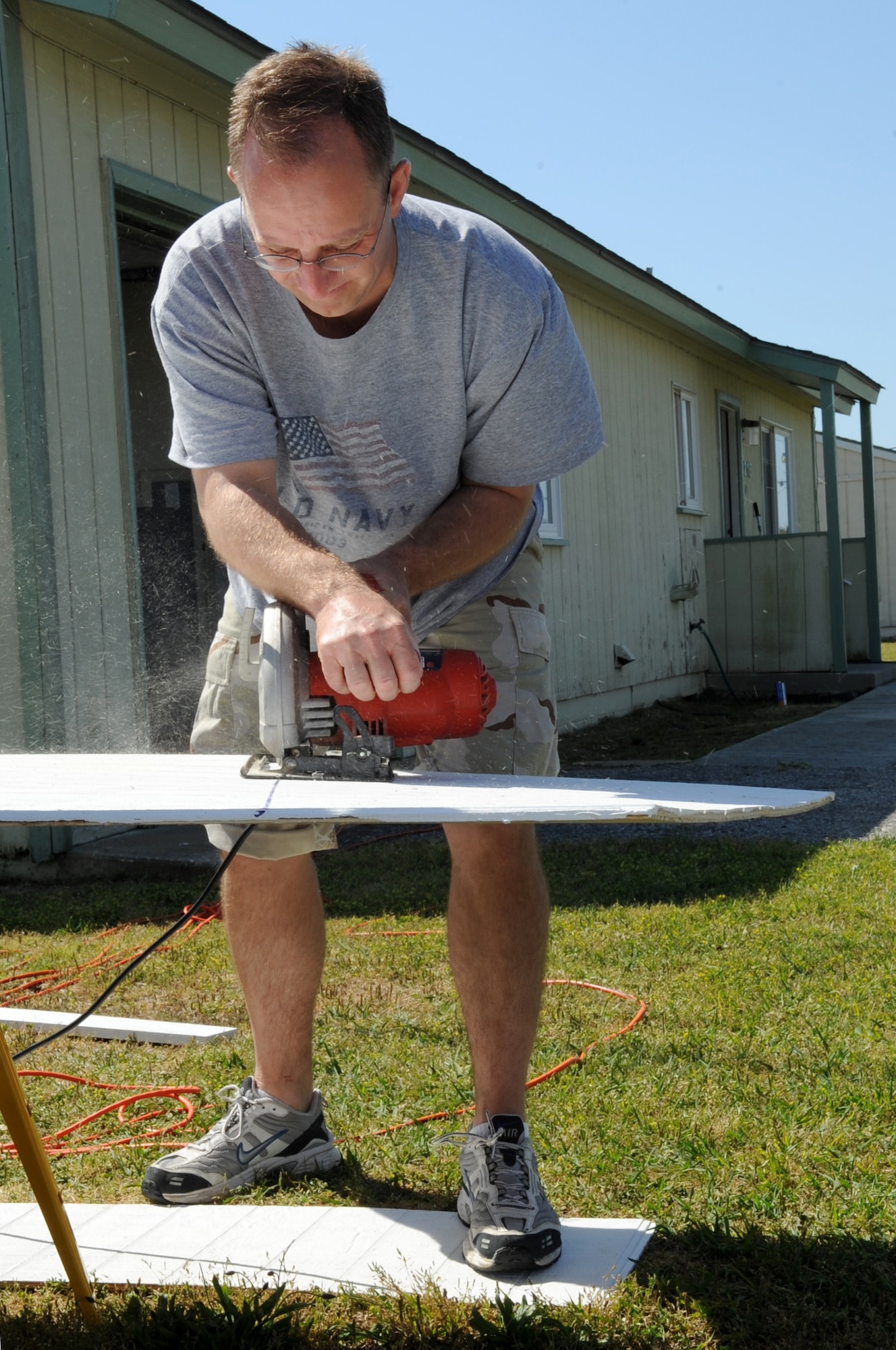 FORT FISHER RECREATION AREA, N.C -- Master Sgt. Christopher Nash uses a circular power saw to cut siding for cottages here, April 7, 2010. Fort Fisher provides an inexpensive vacation for Department of Defense personnel.  It also serves as an official training center for the North Carolina National Guard during non-summer months. Sergeant Nash, 4th Comptroller Squadron first sergeant at Seymour Johnson Air Force Base, is originally from Atlanta. (U.S. Air Force photo/Staff Sergeant Courtney Richardson)