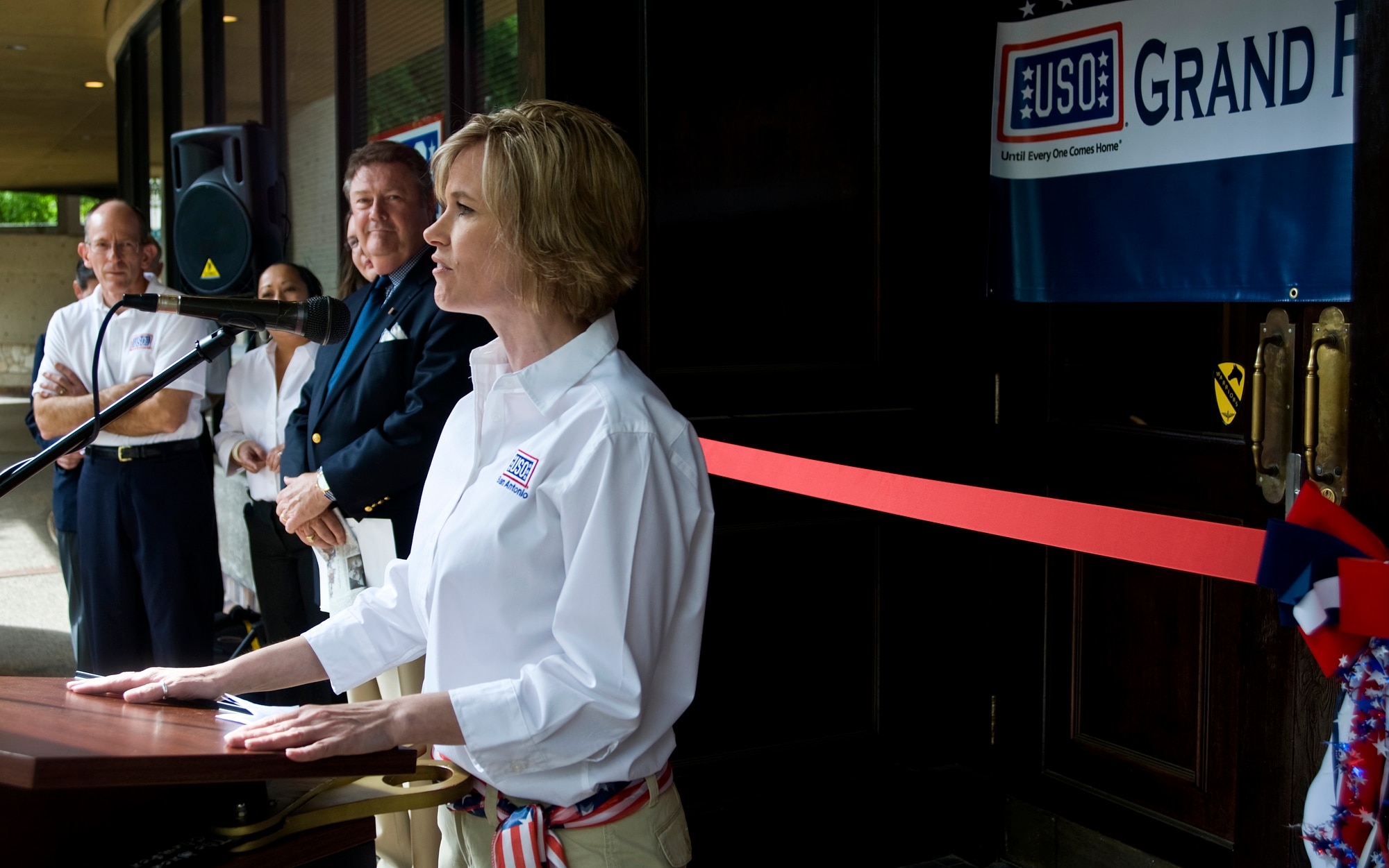 Shari Jenson, director of USO San Antonio, provides welcoming remarks Apr. 7, to the veterans and dignitaries present for the reoping of the USO San Antonio River Center. The center which averages 3,000 patrons a month was closed for a four month renovation to upgrade to a state-of-the-art-facility to better serve the troops stationed in the area.
(U.S. Air Force photo/Staff Sgt. Bennie J. Davis III)